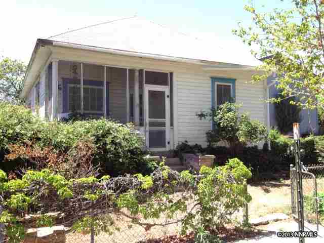 1037 Haskell Street Reno, NV 89509 - Photo 1 of 1 a front view of a house with a yard and flowers