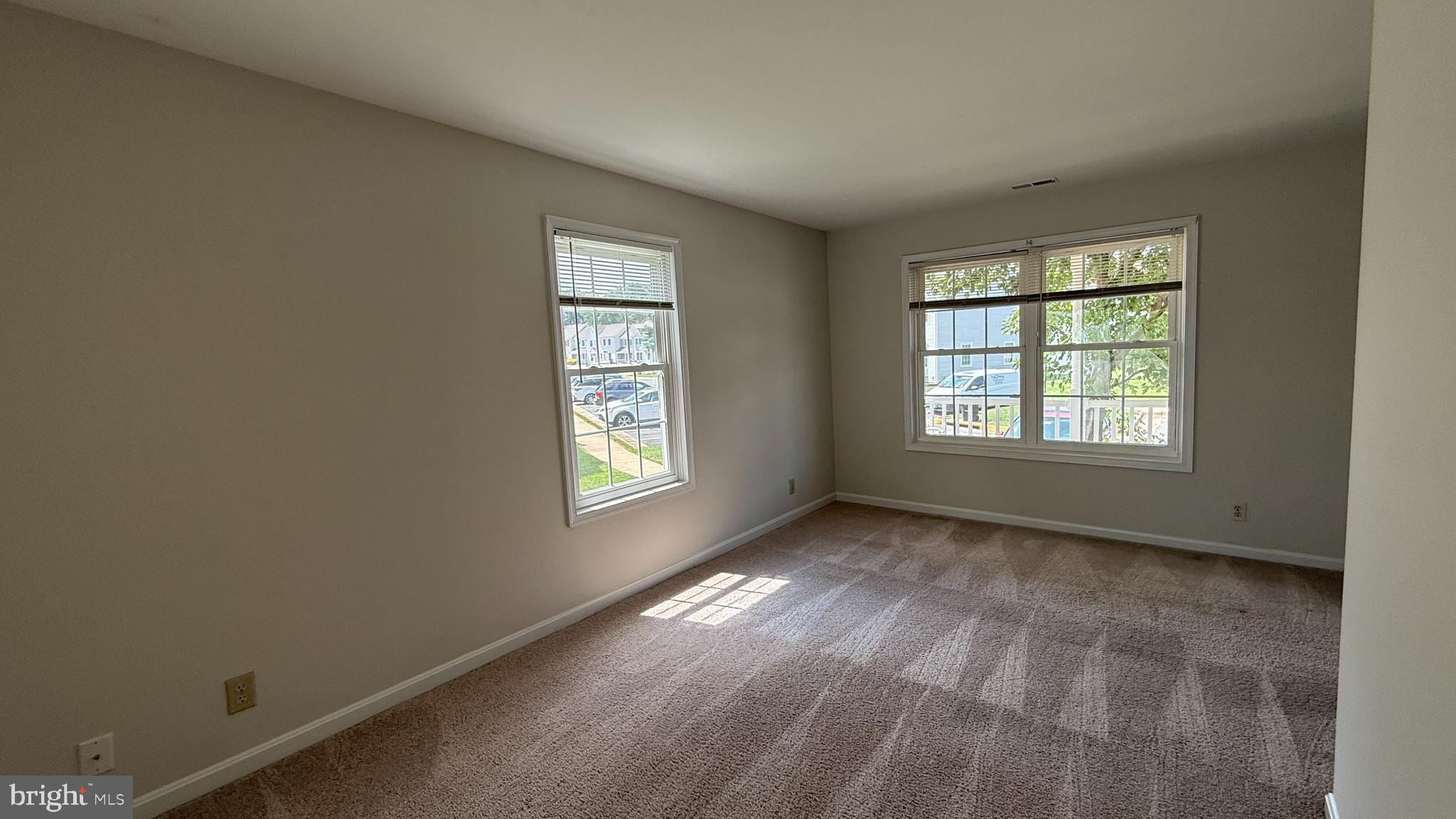 200 Surry Lane, Unit 118 Stafford, VA 22556 - Photo 6 of 13 a view of an empty room with a window