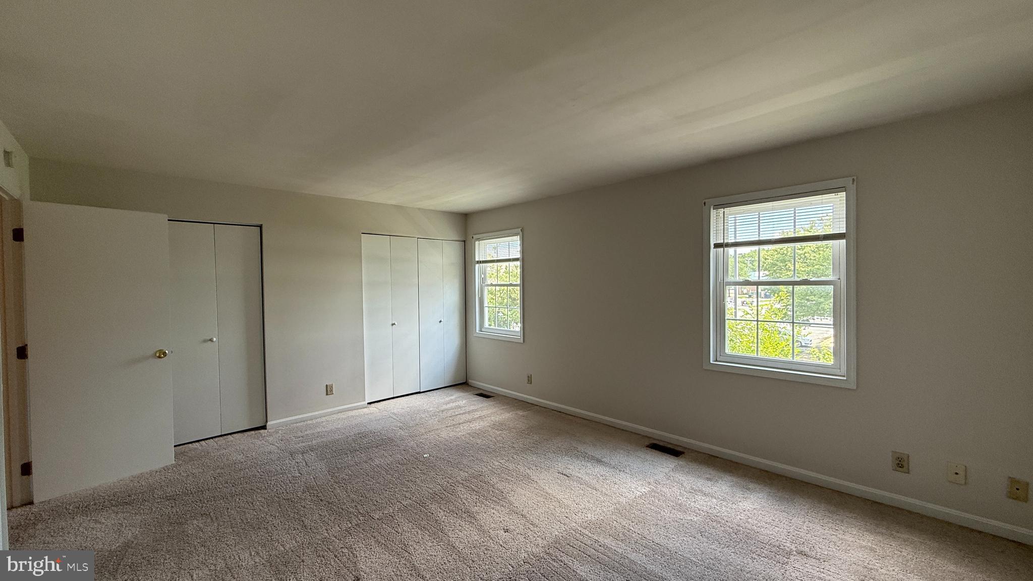 200 Surry Lane, Unit 118 Stafford, VA 22556 - Photo 9 of 13 a view of an empty room with a window