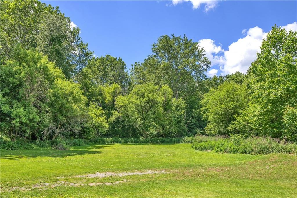 1747 Galilee Road Wampum, PA 16157 - Photo 24 of 32 The tree-lined lot creates a private, park-like setting perfect for unwinding at home.