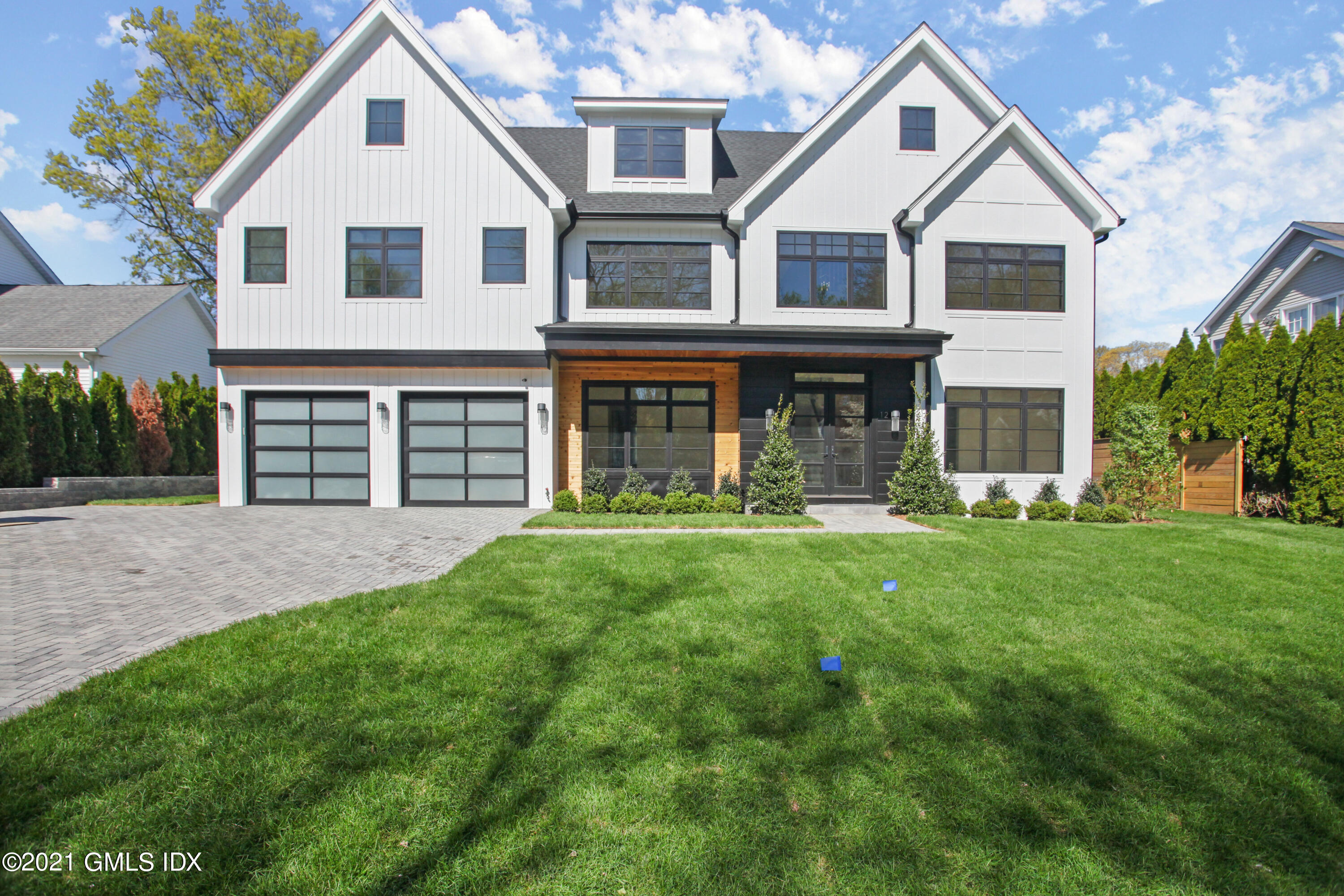 12 Dialstone Lane Riverside, CT 06878 - Photo 1 of 66 a front view of a house with yard