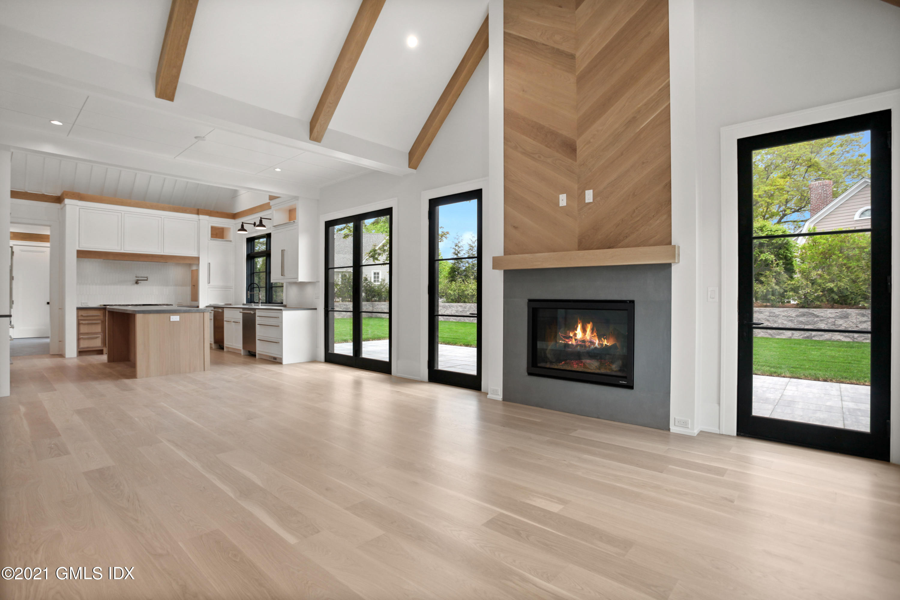 12 Dialstone Lane Riverside, CT 06878 - Photo 20 of 66 a view of an empty room with a fireplace and a window