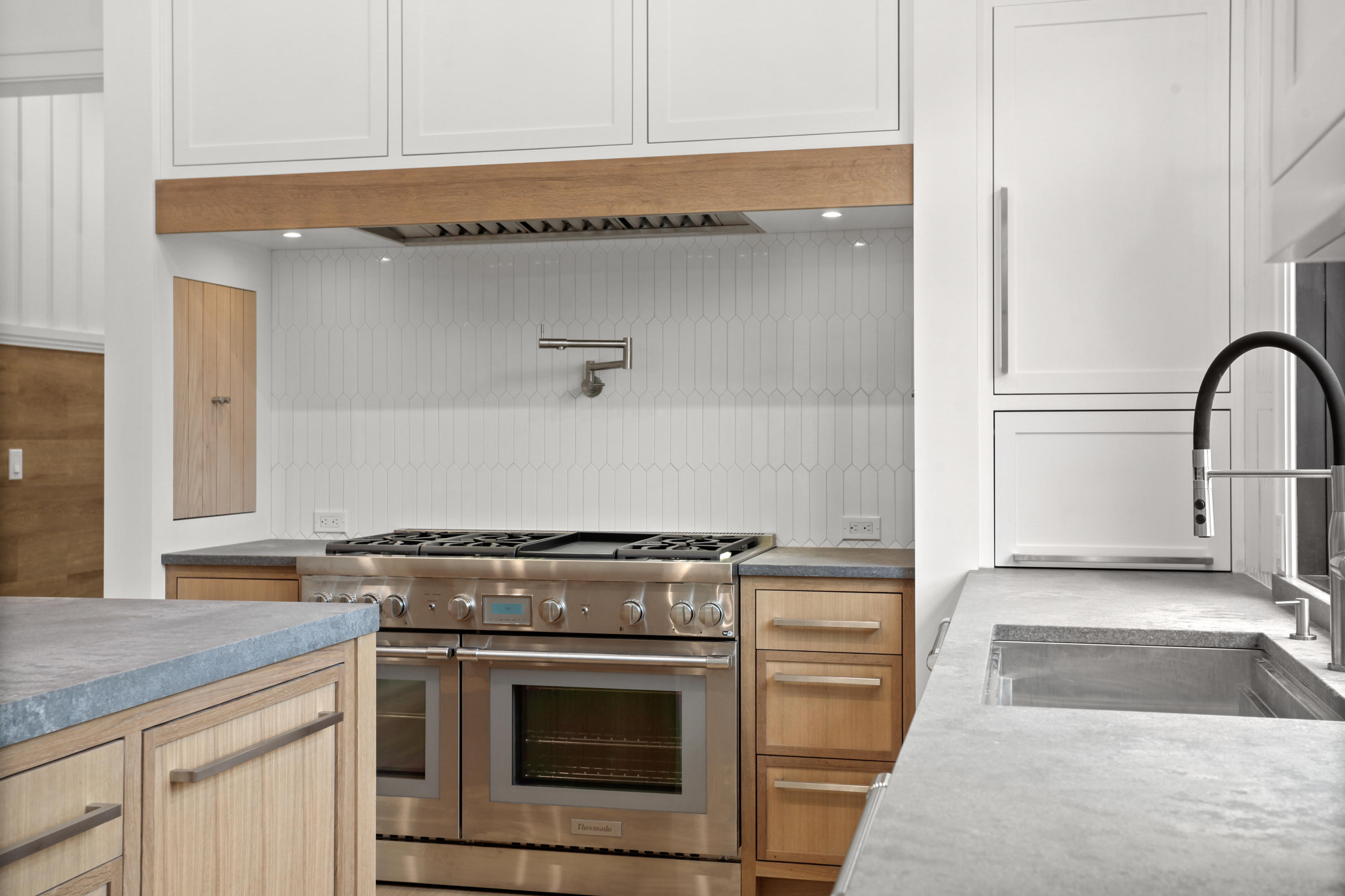 12 Dialstone Lane Riverside, CT 06878 - Photo 27 of 66 a kitchen with granite countertop a stove and a sink