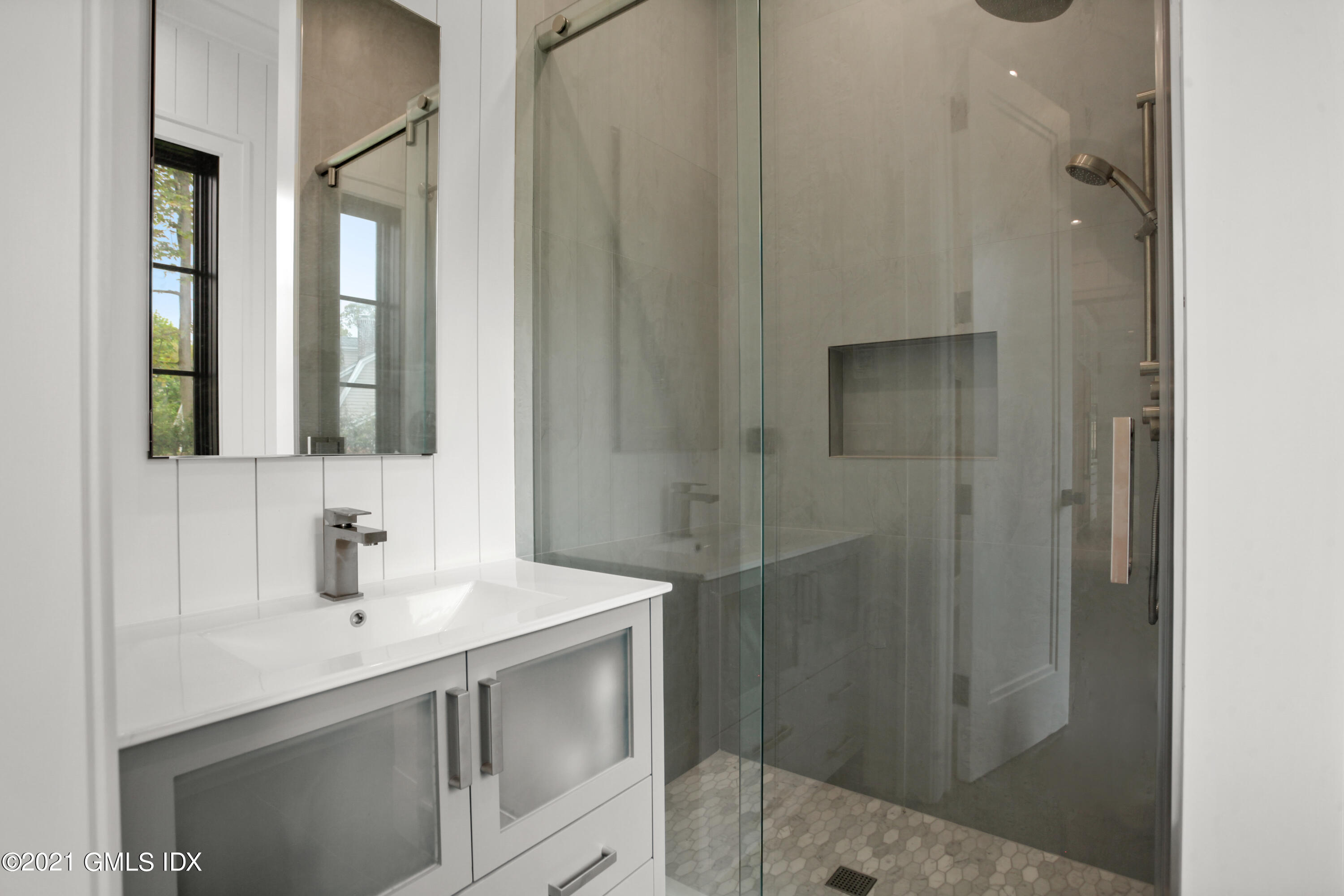 12 Dialstone Lane Riverside, CT 06878 - Photo 33 of 66 a bathroom with a sink and mirror