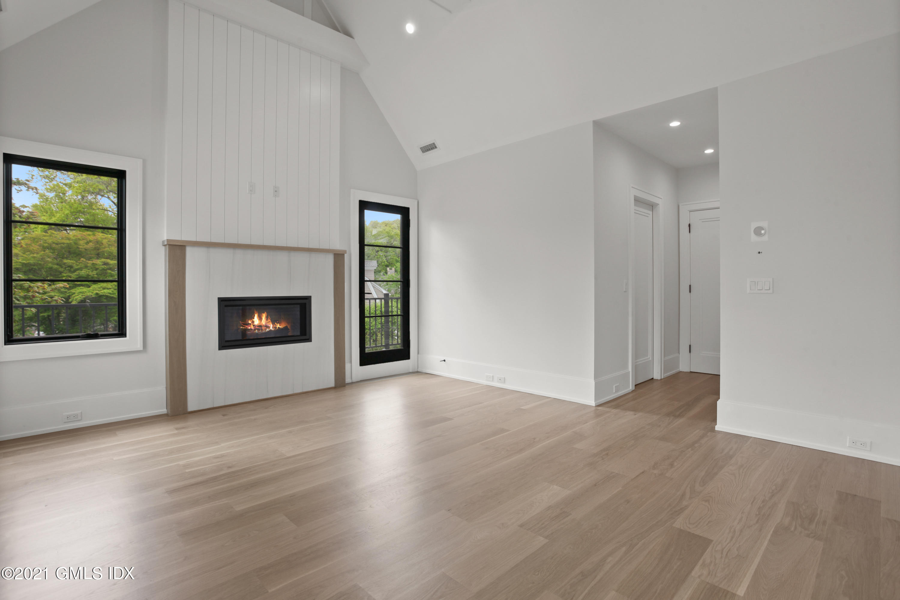 12 Dialstone Lane Riverside, CT 06878 - Photo 36 of 66 a view of an empty room with a fireplace and a window