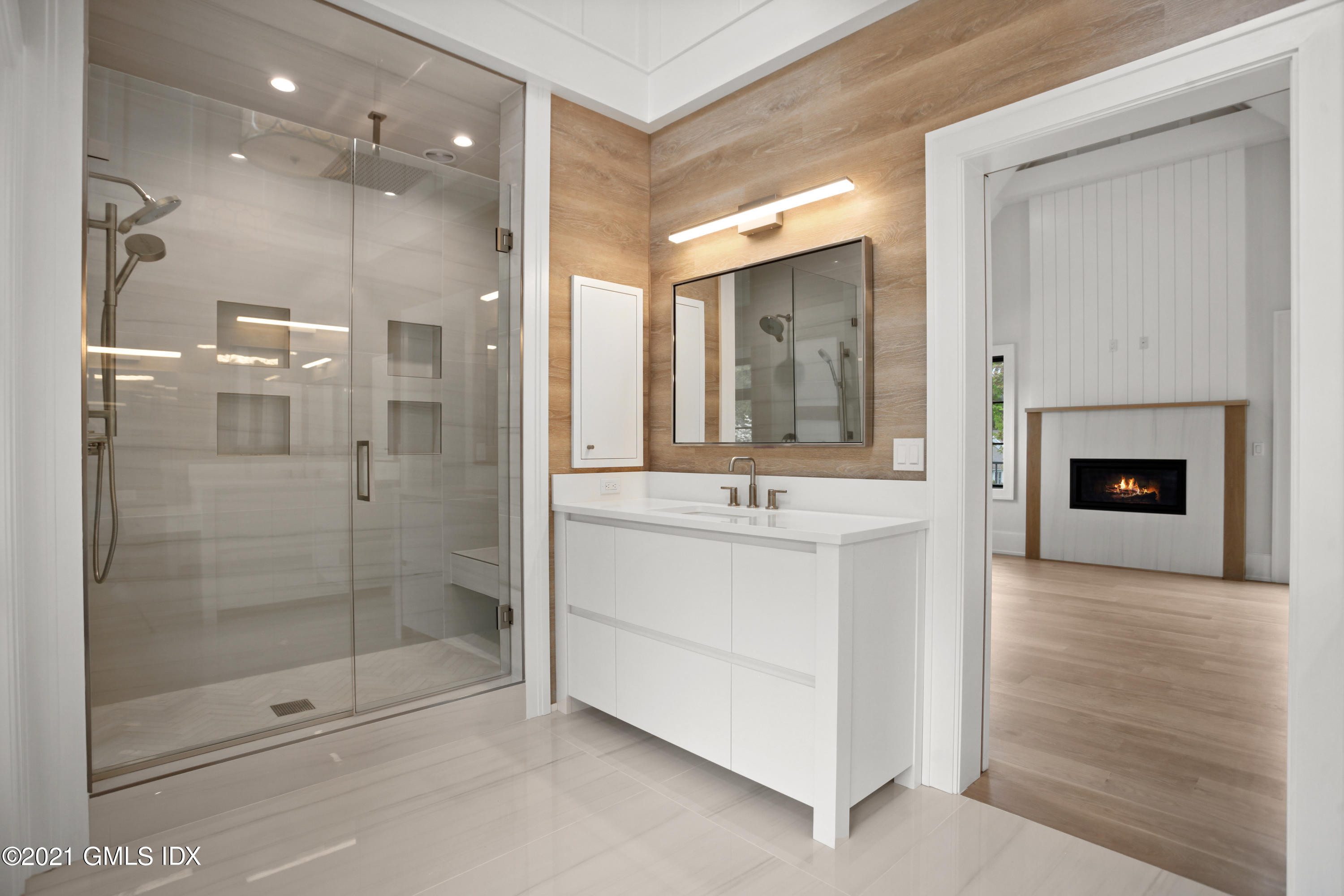 12 Dialstone Lane Riverside, CT 06878 - Photo 38 of 66 a bathroom with a sink shower and a mirror