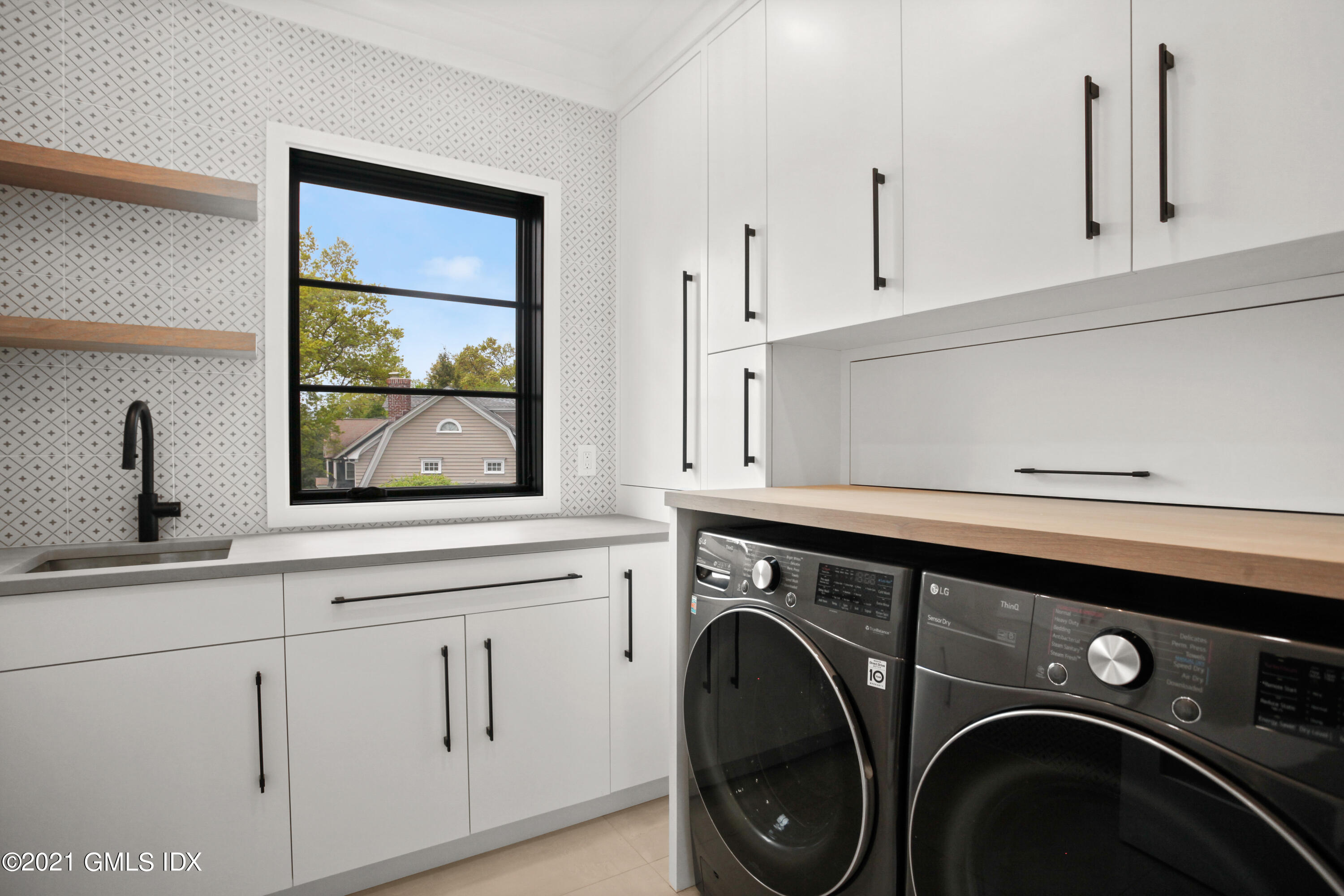 12 Dialstone Lane Riverside, CT 06878 - Photo 45 of 66 a utility room with dryer and washer
