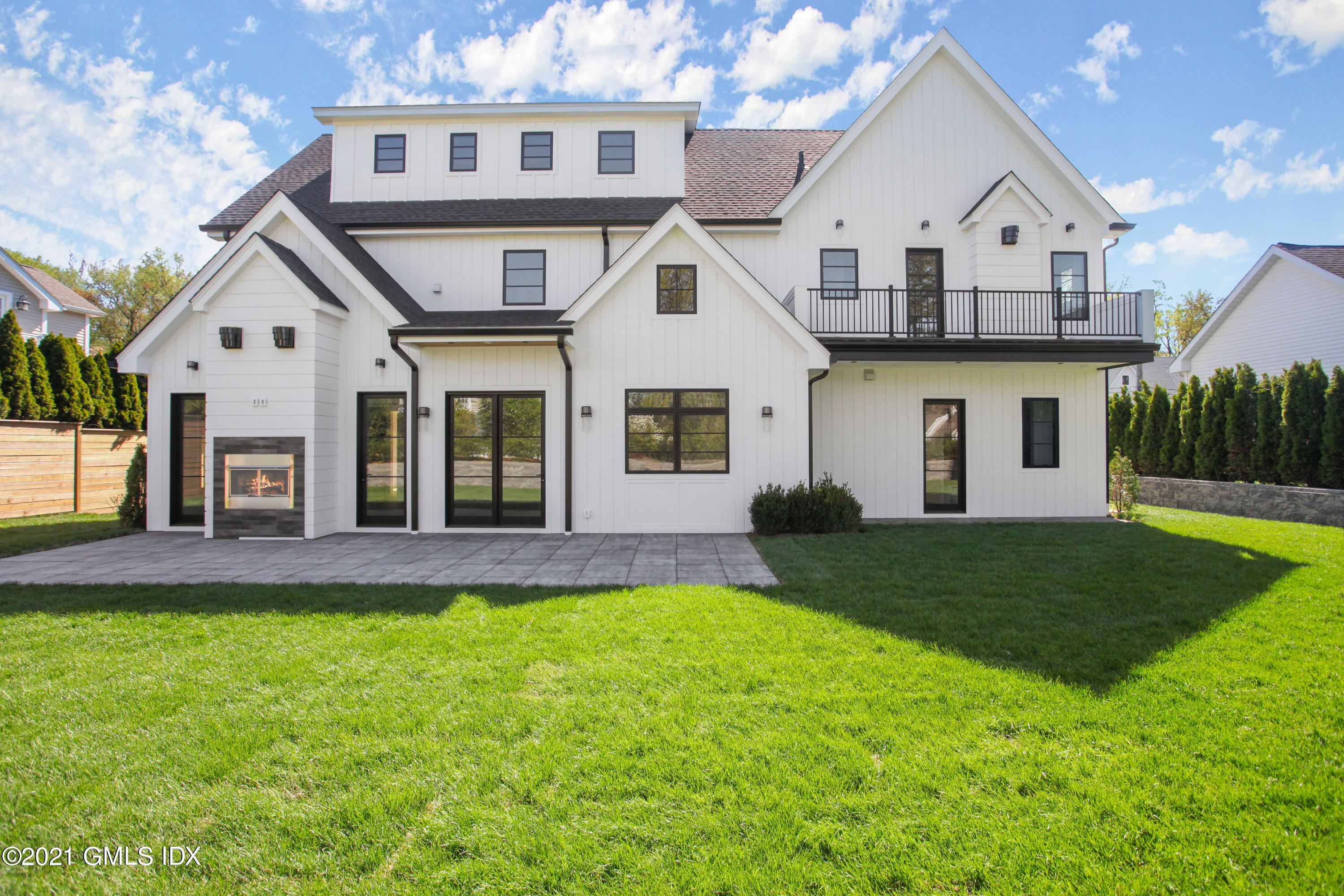 12 Dialstone Lane Riverside, CT 06878 - Photo 5 of 66 a front view of a house with a yard and garage