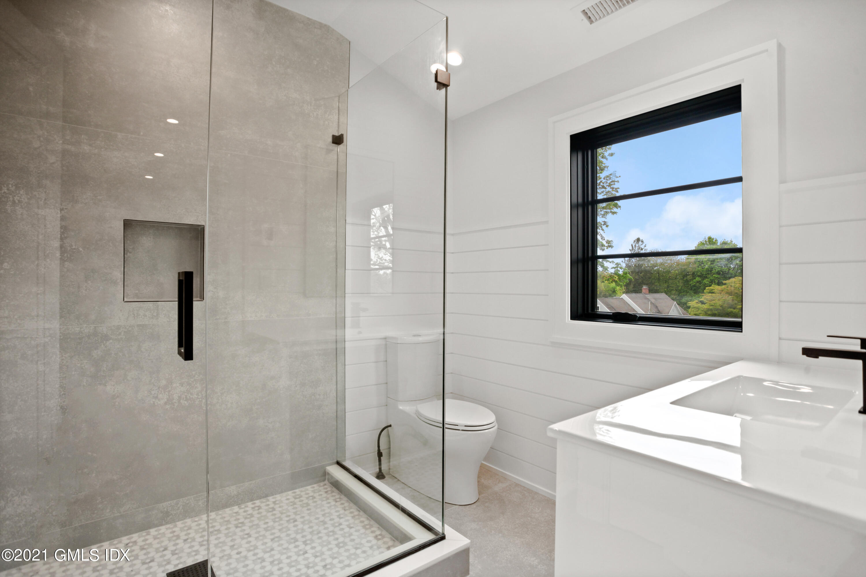 12 Dialstone Lane Riverside, CT 06878 - Photo 52 of 66 a bathroom with a sink a toilet and shower