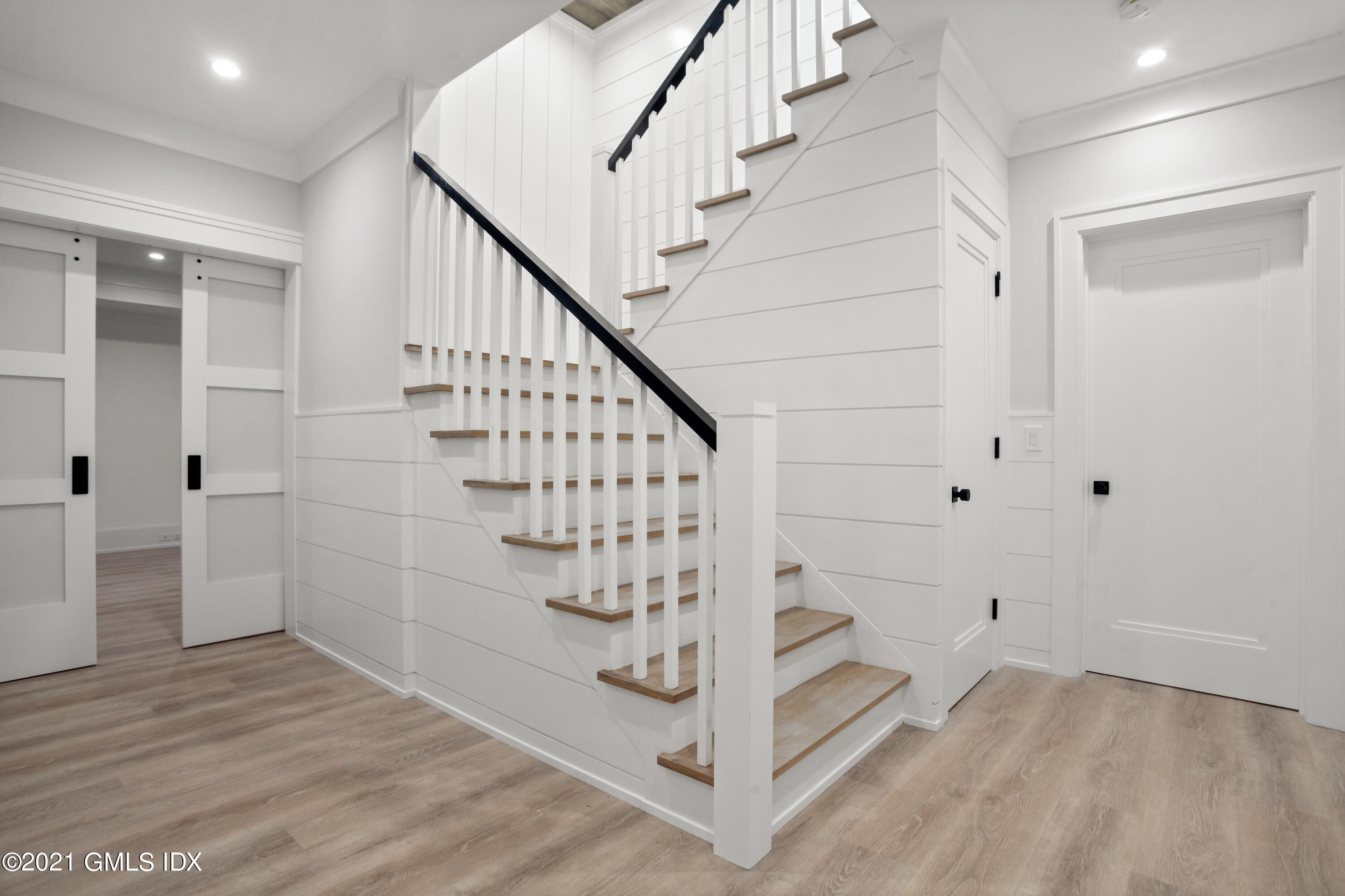 12 Dialstone Lane Riverside, CT 06878 - Photo 53 of 66 a view of entryway with stairs and wooden floor