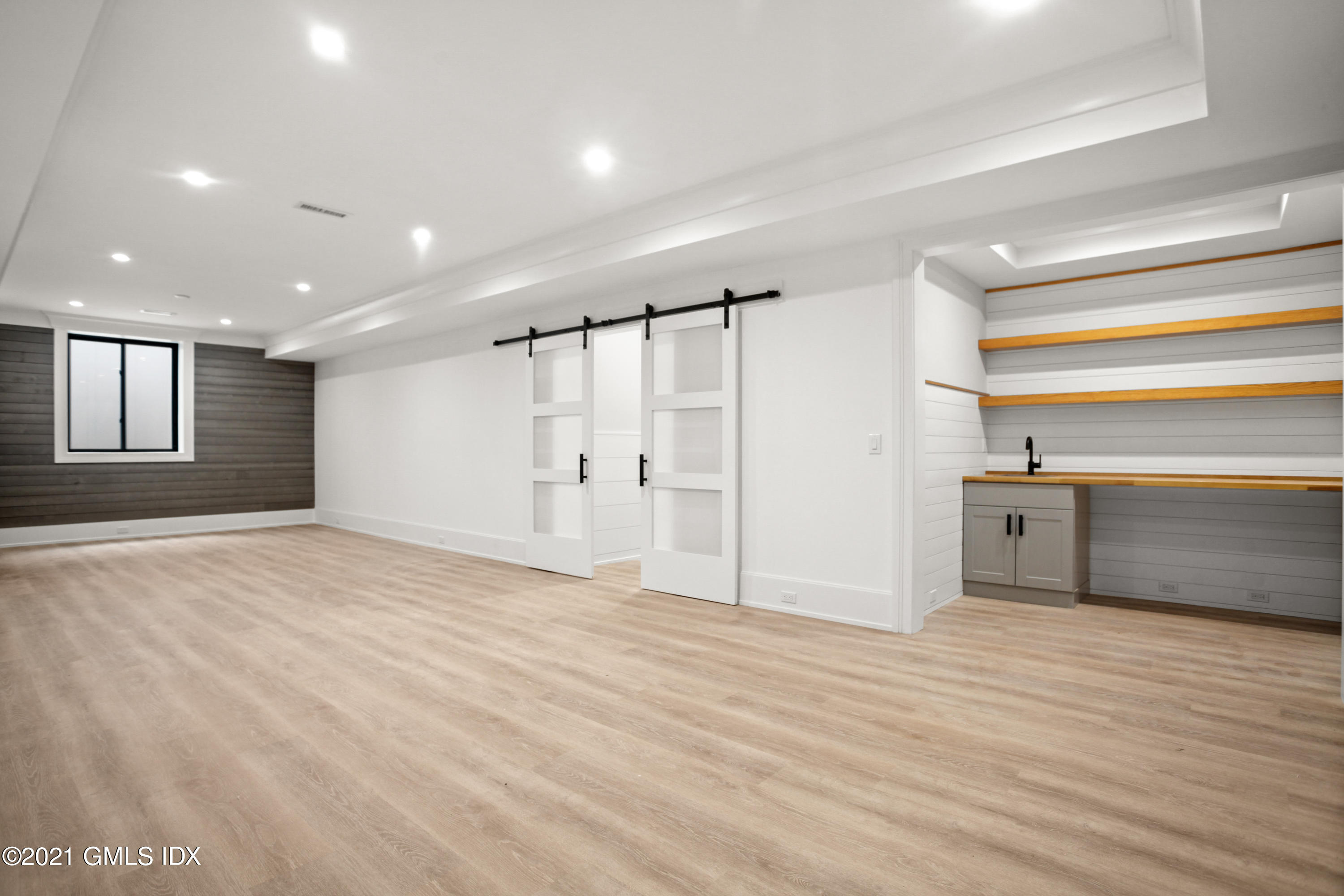 12 Dialstone Lane Riverside, CT 06878 - Photo 60 of 66 a view of empty room with wooden floor