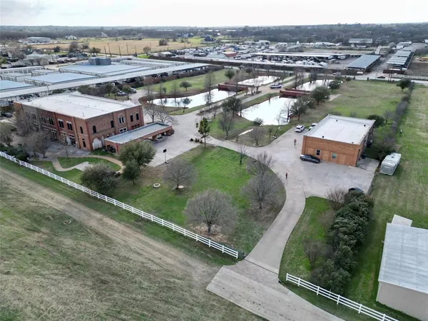 an aerial view of a house with a lake view