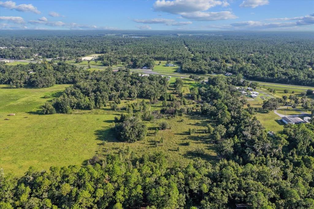 Ne Highway Bronson, FL 32621 - Photo 11 of 28 an aerial view of residential houses with outdoor space and trees