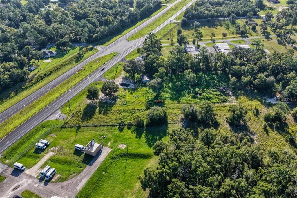 Ne Highway Bronson, FL 32621 - Photo 17 of 28 a view of swimming pool with a yard and plants