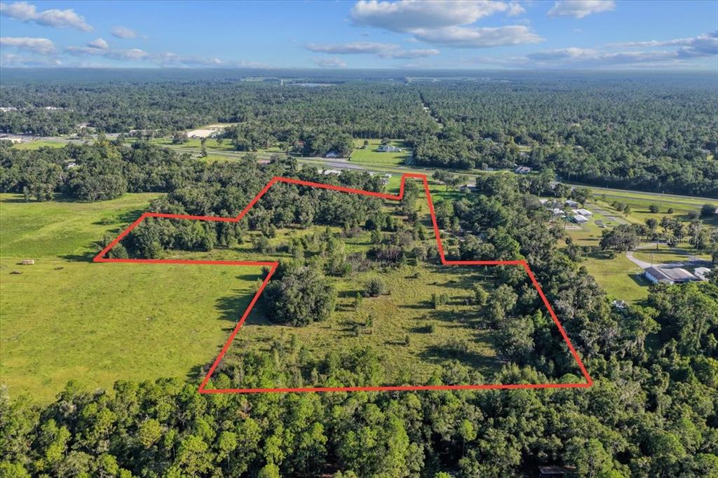 Ne Highway Bronson, FL 32621 - Photo 3 of 28 an aerial view of residential houses with outdoor space and trees
