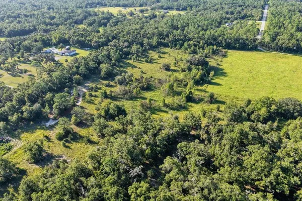 a view of a fence and a city view