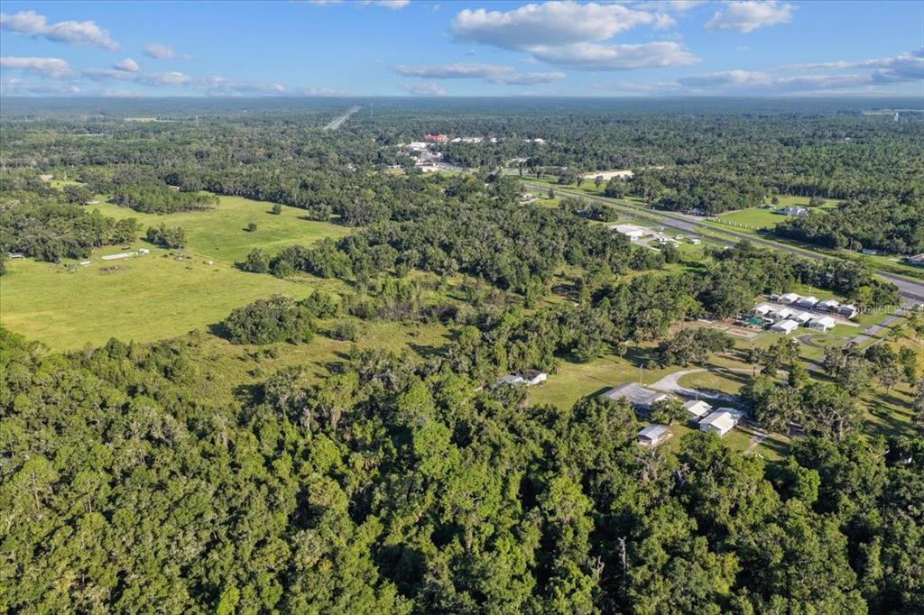 Ne Highway Bronson, FL 32621 - Photo 9 of 28 an aerial view of residential houses with outdoor space and trees