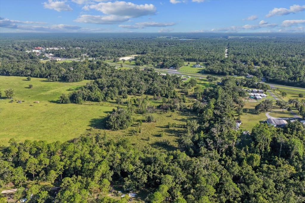 Ne Highway Bronson, FL 32621 - Photo 10 of 28 an aerial view of residential houses with outdoor space and trees