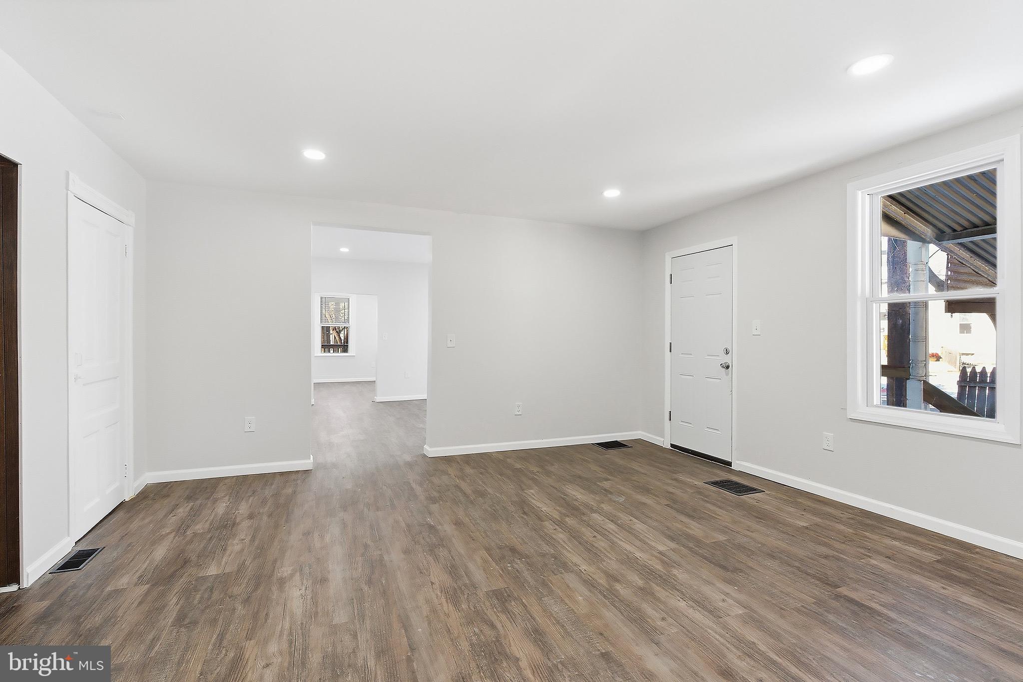 1000 West 3rd Street Florence, NJ 08518 - Photo 12 of 42 a view of empty room with wooden floor and fan