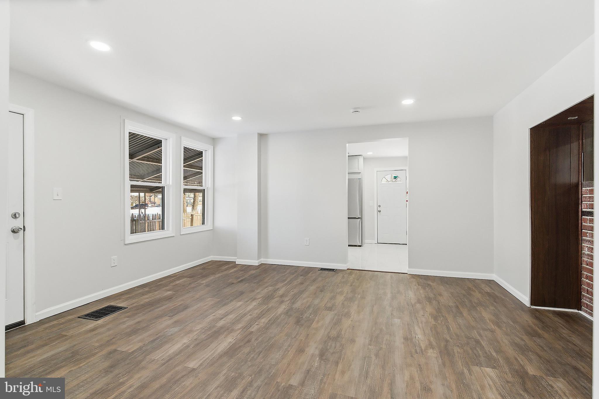 1000 West 3rd Street Florence, NJ 08518 - Photo 13 of 42 a view of an empty room with wooden floor and windows