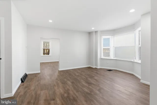 a kitchen with cabinets and stainless steel appliances