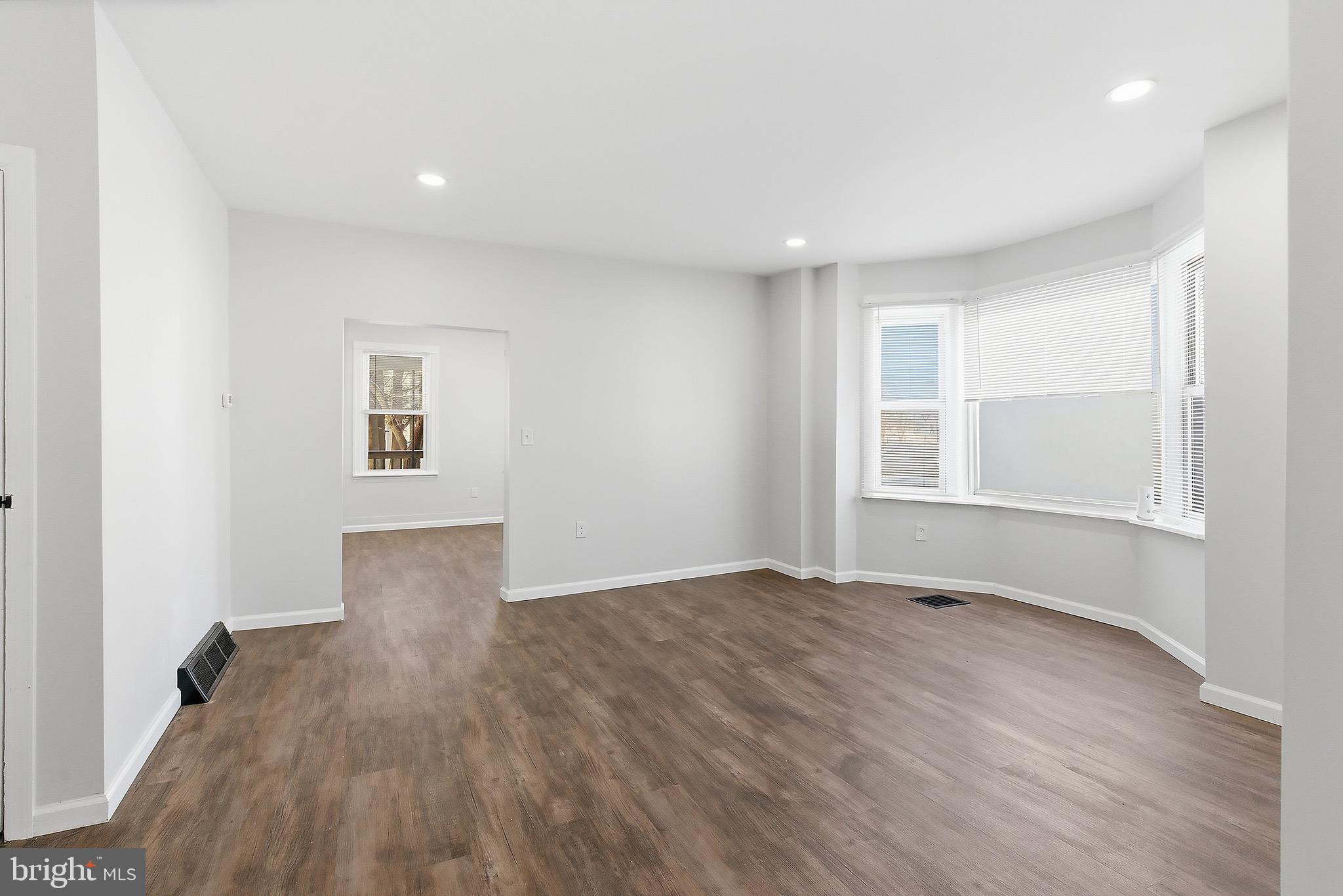 1000 West 3rd Street Florence, NJ 08518 - Photo 15 of 42 an empty room with wooden floor and windows