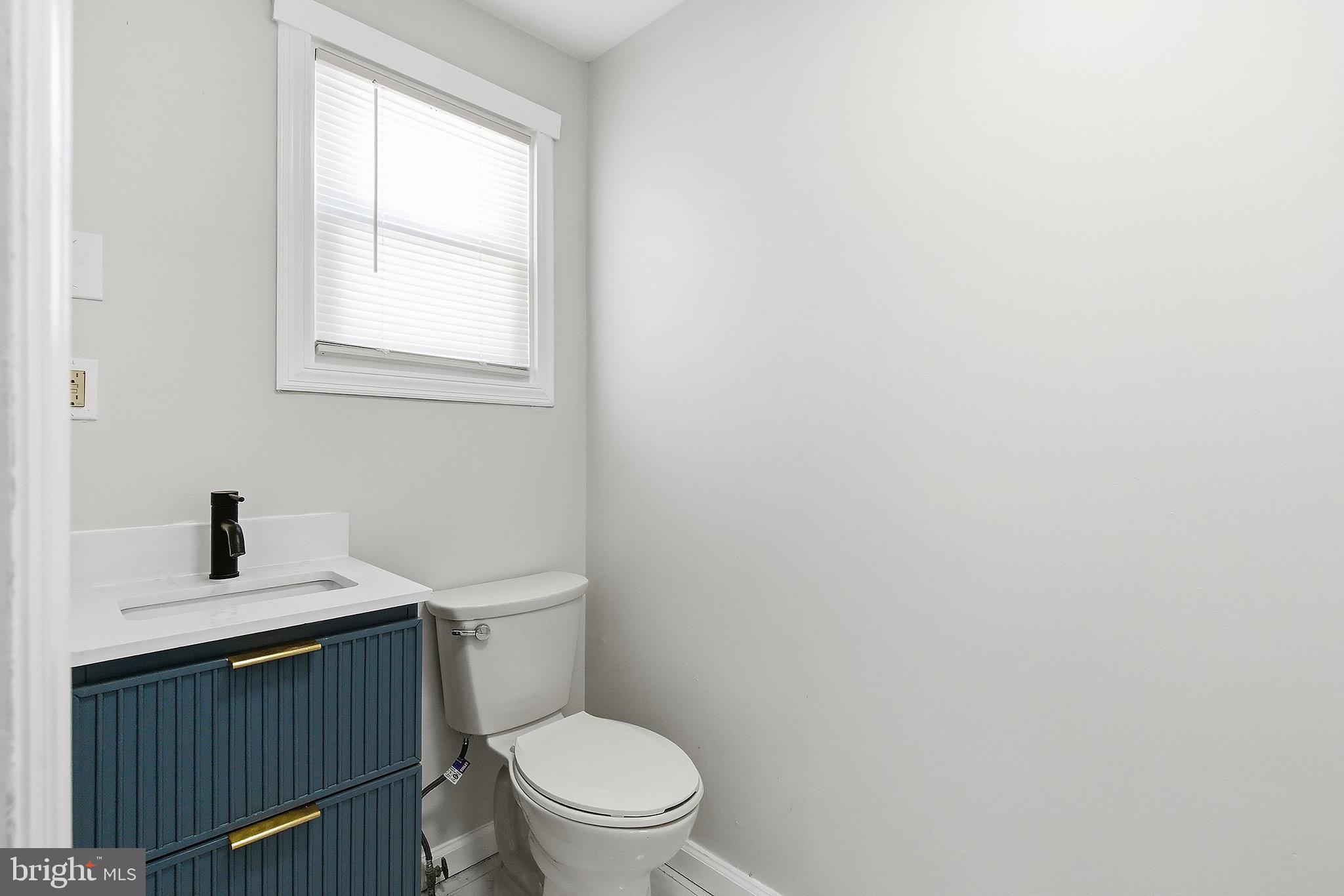 1000 West 3rd Street Florence, NJ 08518 - Photo 20 of 42 a white toilet sitting next to a bathroom sink