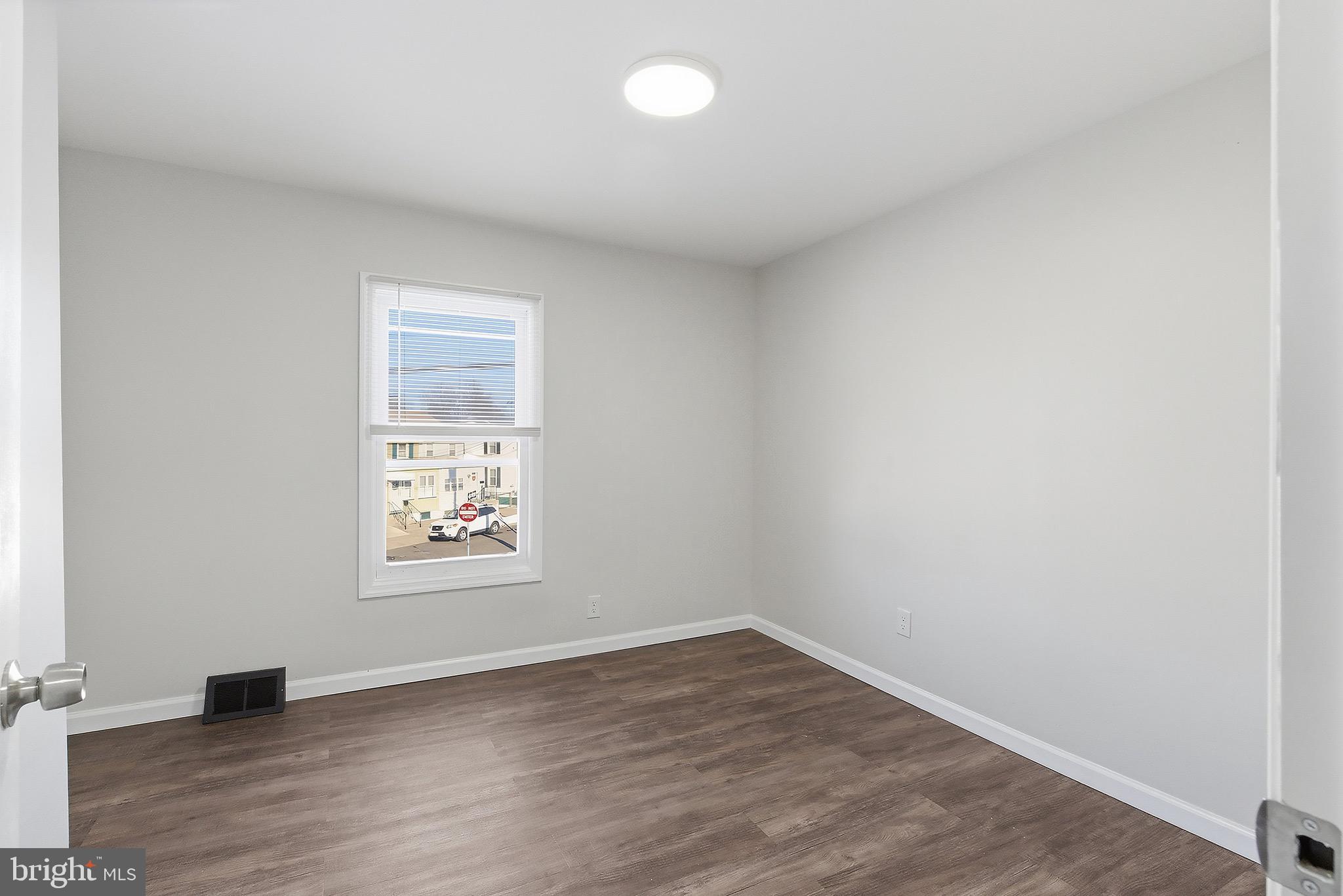1000 West 3rd Street Florence, NJ 08518 - Photo 25 of 42 an empty room with wooden floor and windows