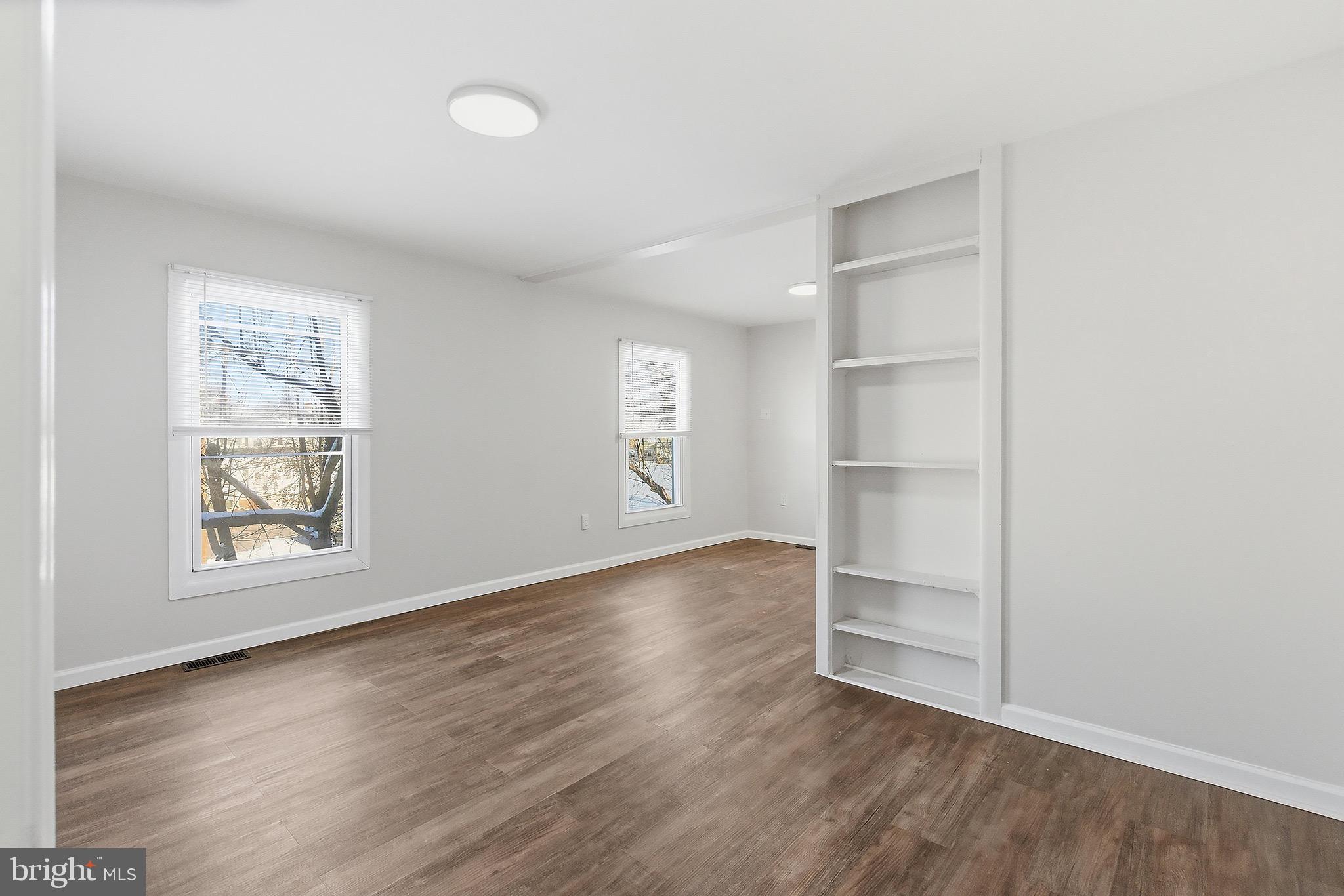 1000 West 3rd Street Florence, NJ 08518 - Photo 27 of 42 an empty room with wooden floor and window