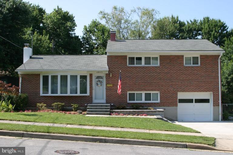 2003 Helmsby Road Baltimore, MD 21228 - Photo 1 of 26 a front view of a house with a yard