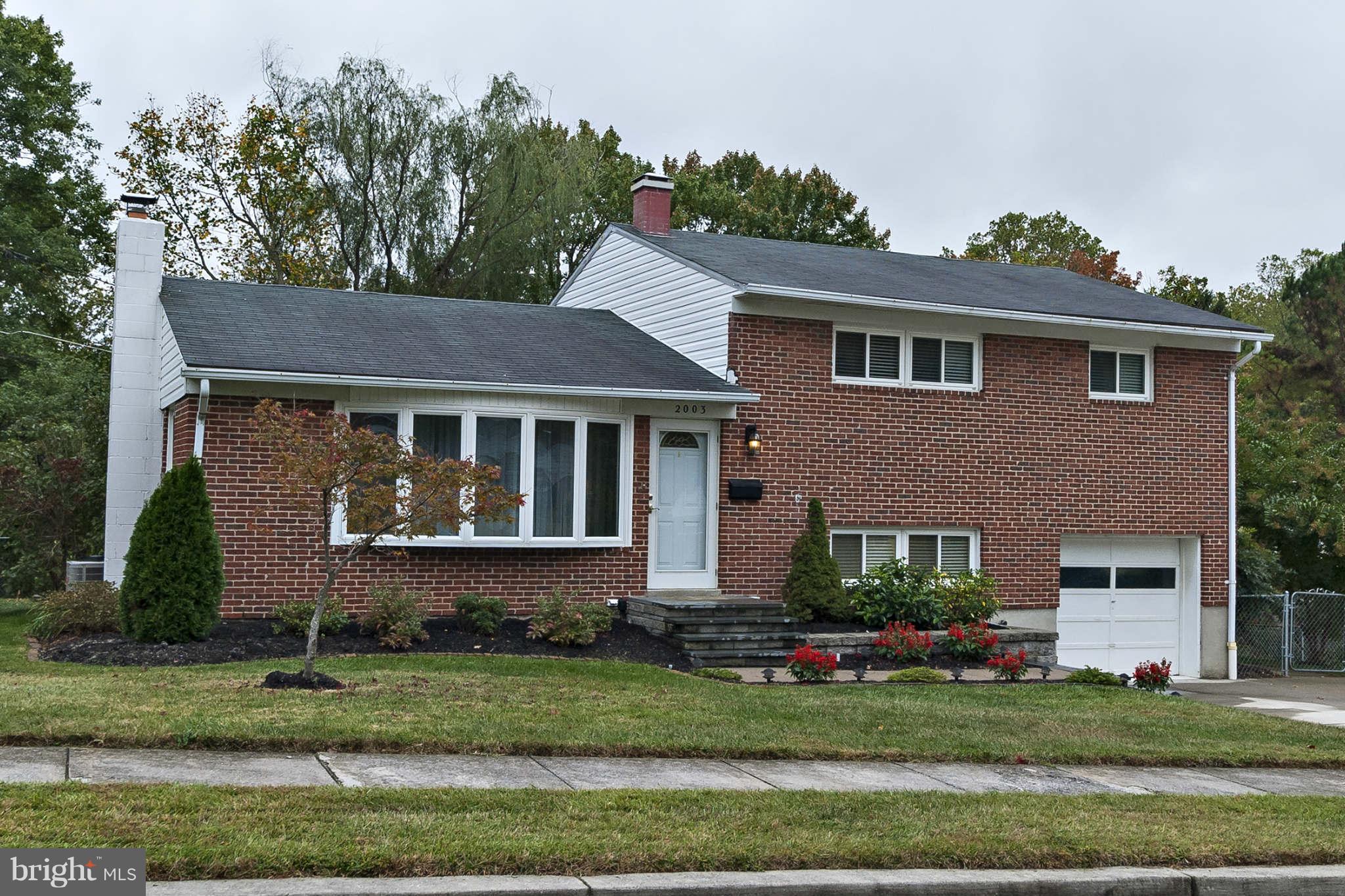 2003 Helmsby Road Baltimore, MD 21228 - Photo 2 of 26 a front view of a house with a yard