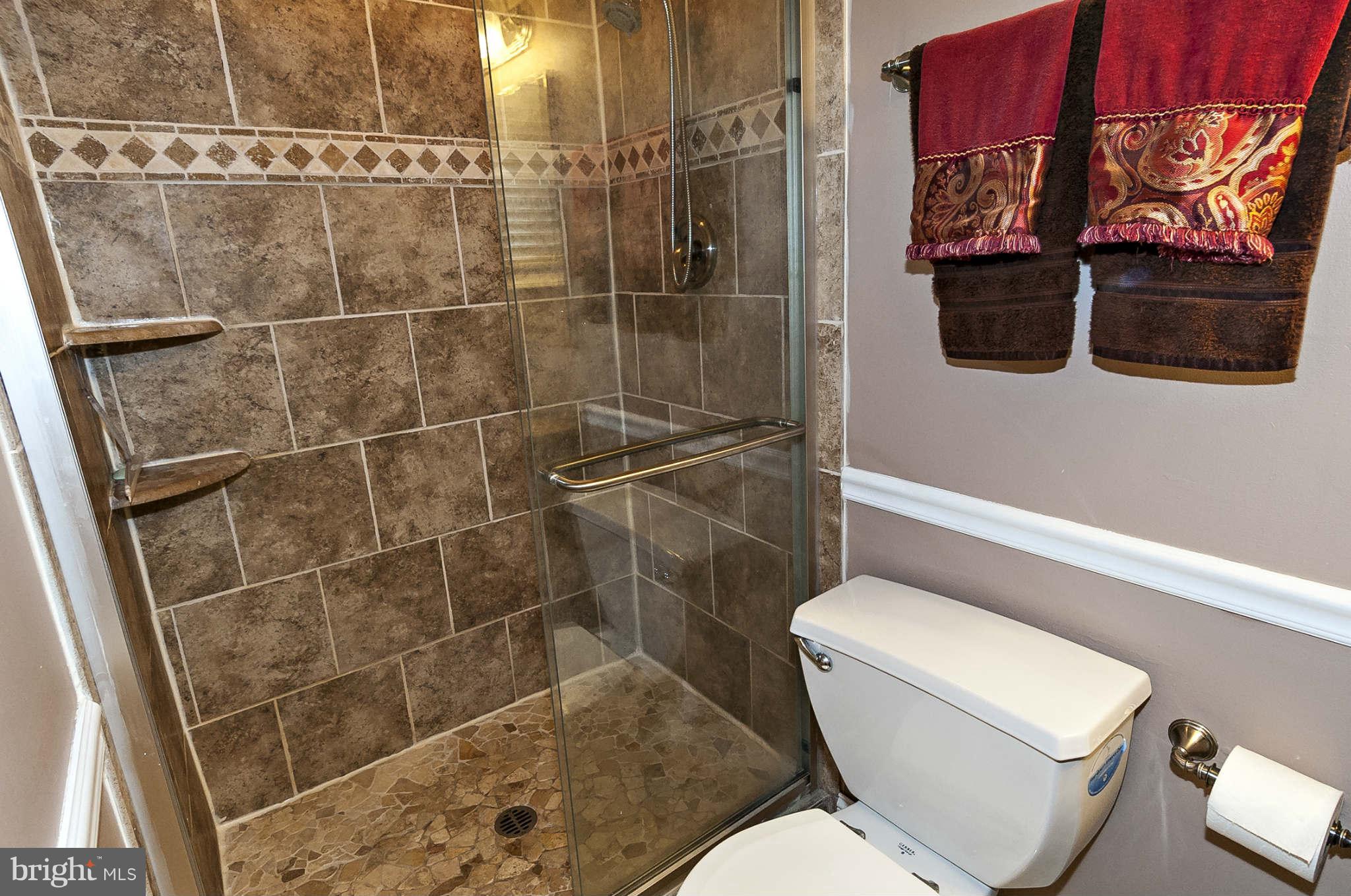 2003 Helmsby Road Baltimore, MD 21228 - Photo 19 of 26 a bathroom with a toilet and a shower
