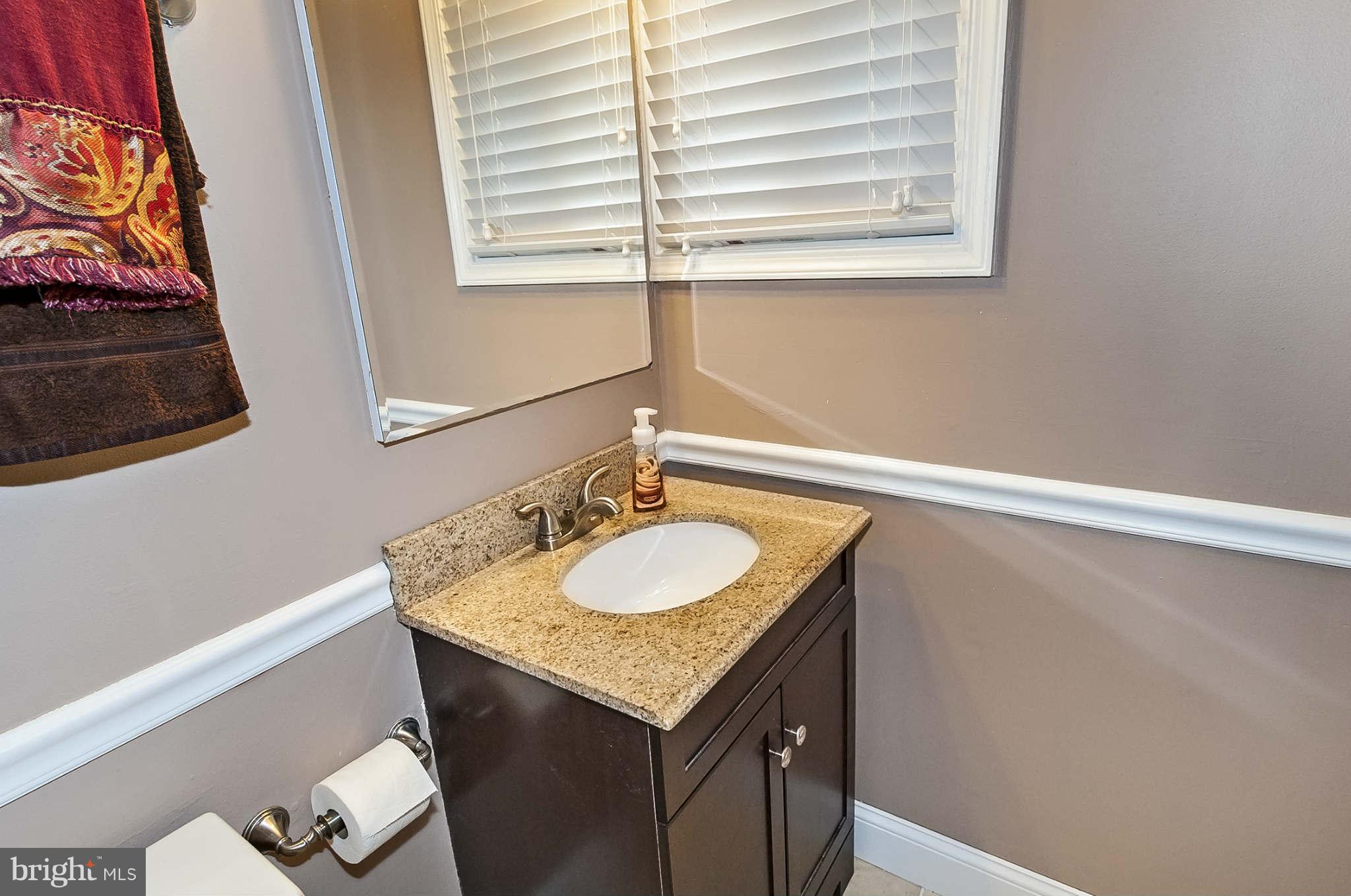 2003 Helmsby Road Baltimore, MD 21228 - Photo 20 of 26 a bathroom with a sink and a mirror