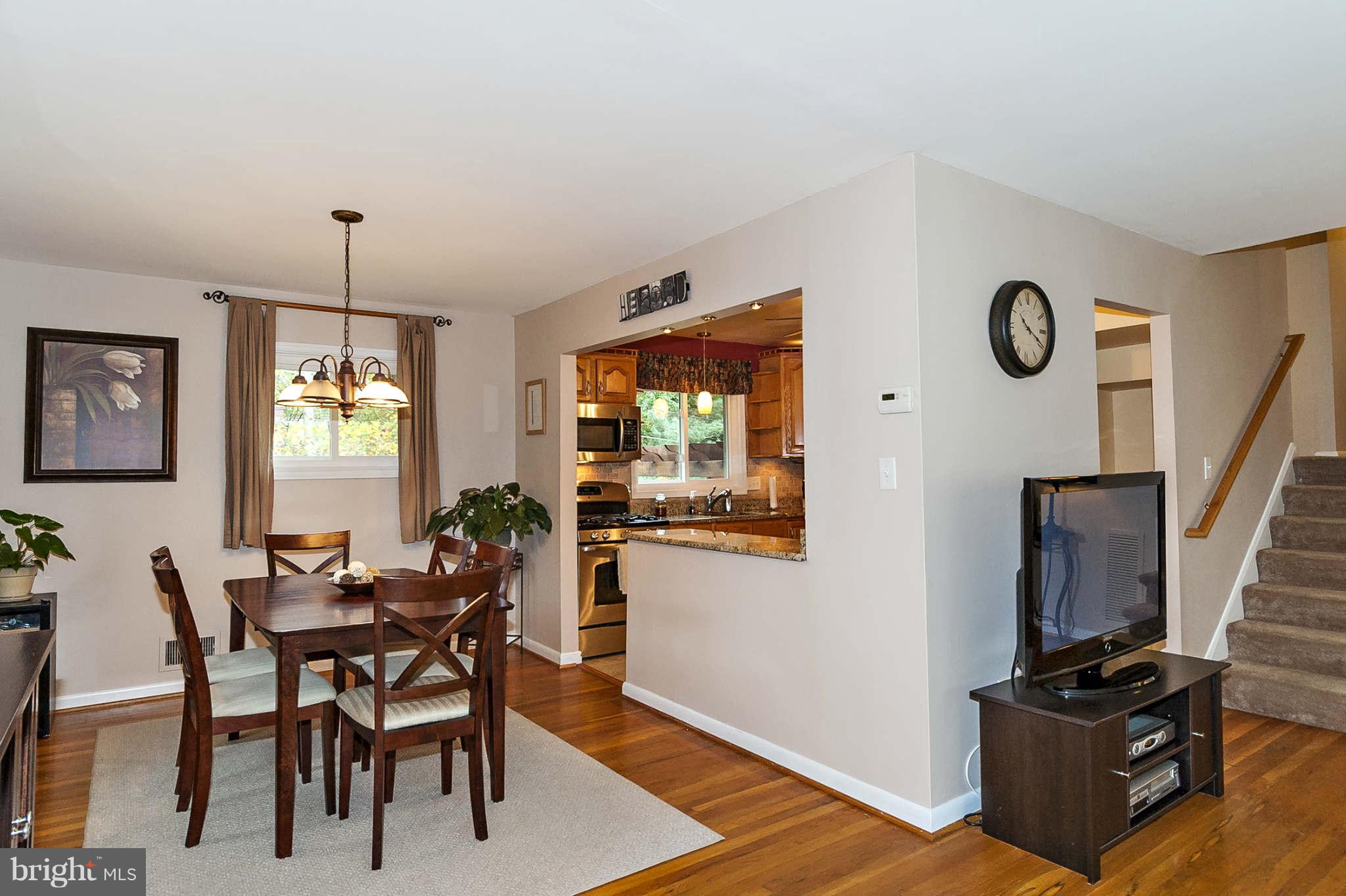 2003 Helmsby Road Baltimore, MD 21228 - Photo 5 of 26 a view of a dining room with furniture window and wooden floor