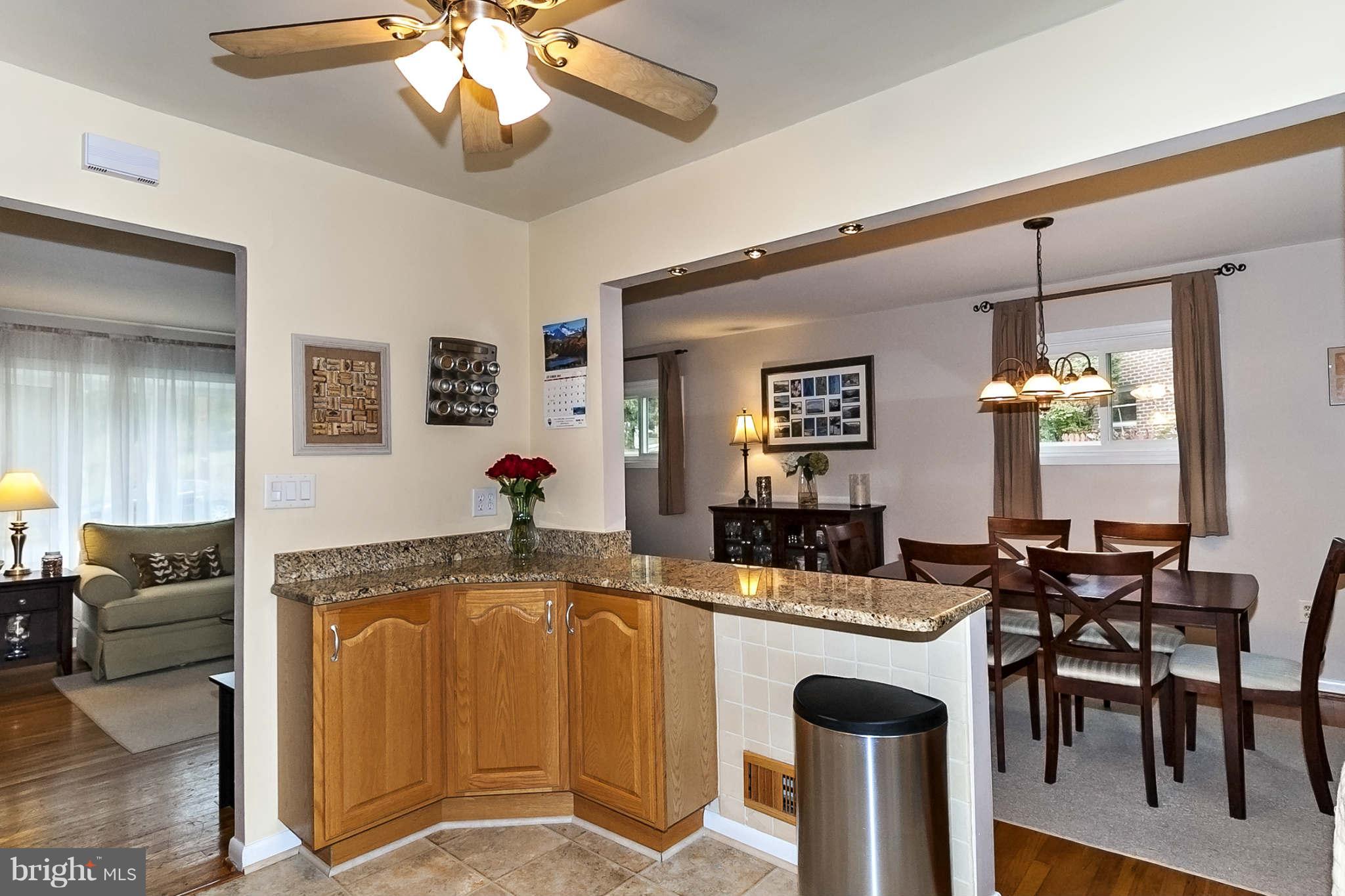 2003 Helmsby Road Baltimore, MD 21228 - Photo 7 of 26 a living room with granite countertop furniture and a chandelier
