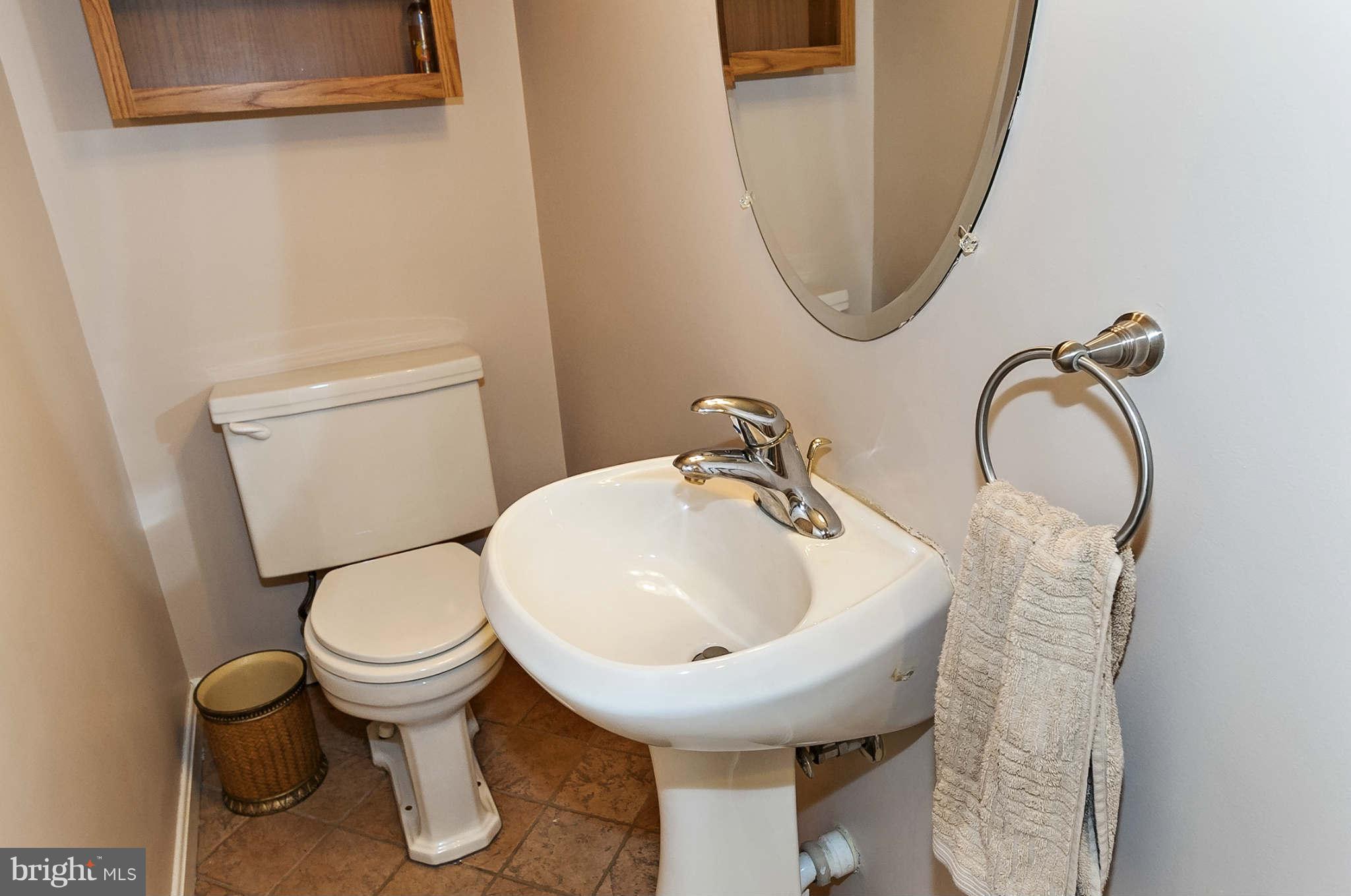 2003 Helmsby Road Baltimore, MD 21228 - Photo 10 of 26 a bathroom with a toilet sink and mirror