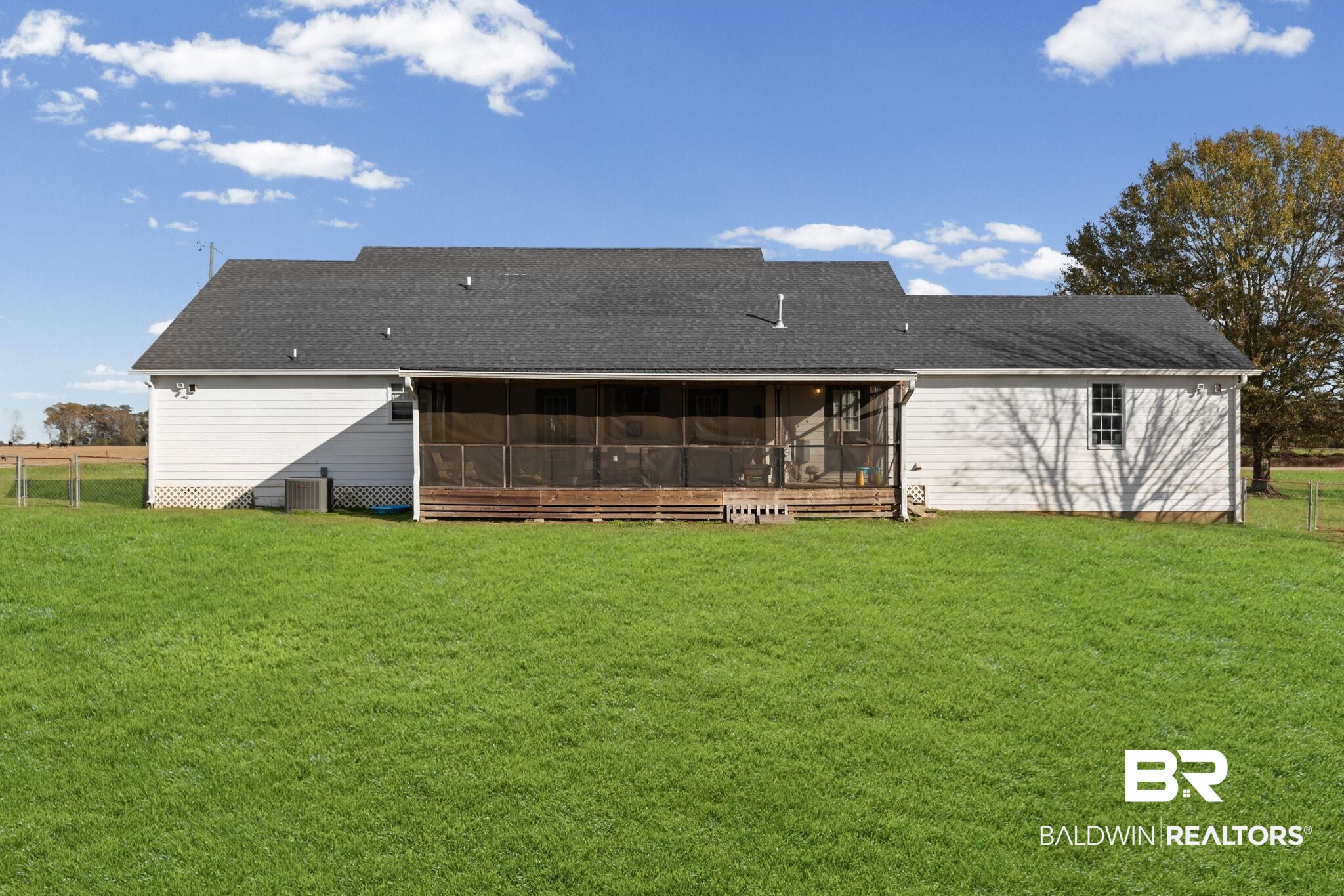 3842 Experiment Farm Road Monroeville, AL 36460 - Photo 10 of 59 Rear view of house with a sunroom and a shingled roof