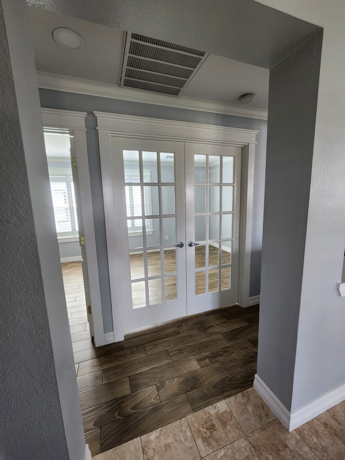 15506 Red Pine Ridge Way Houston, TX 77049 - Photo 16 of 49 wooden floor in an empty room with a window