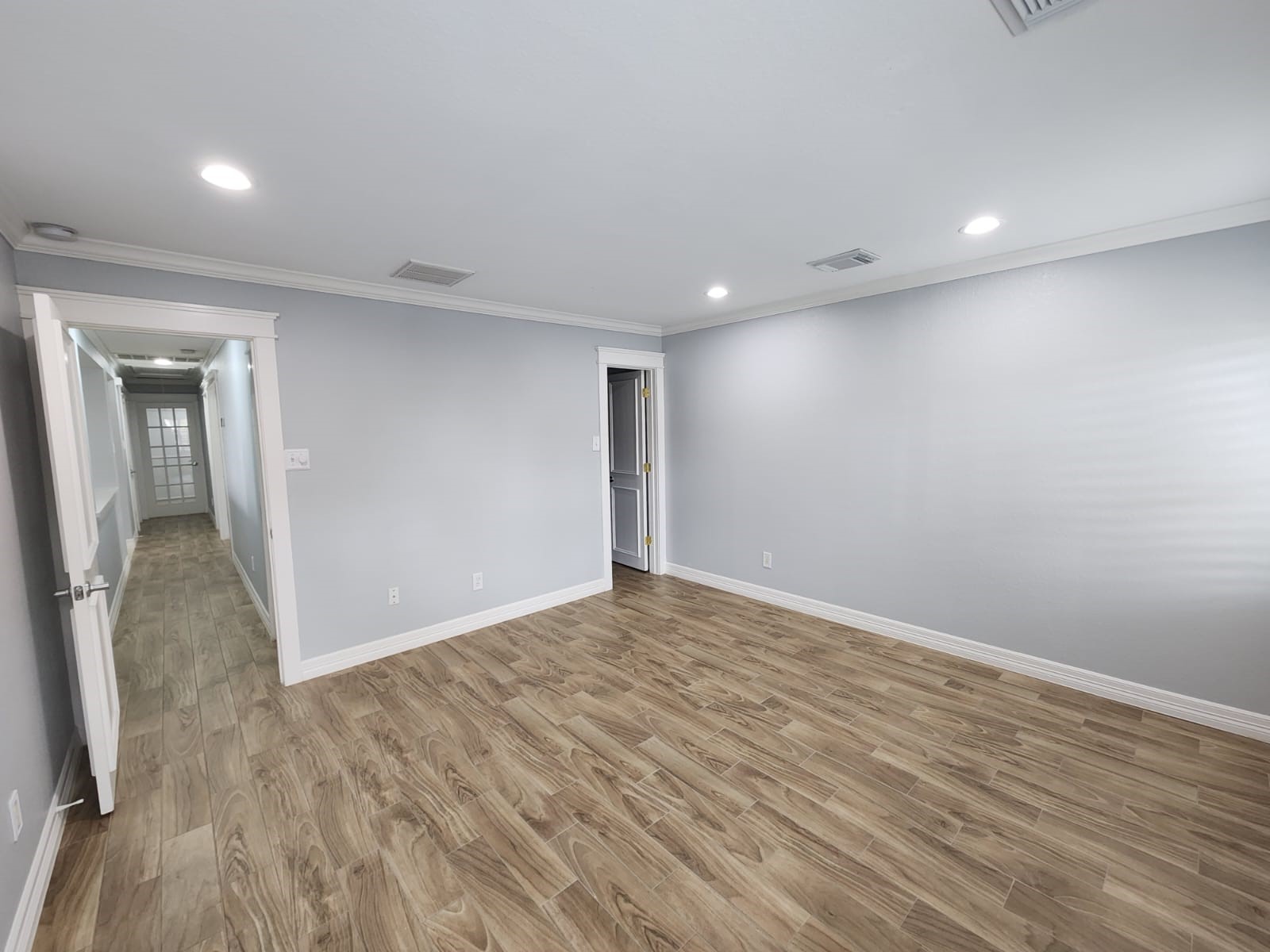 15506 Red Pine Ridge Way Houston, TX 77049 - Photo 21 of 49 wooden floor in an empty room with a window