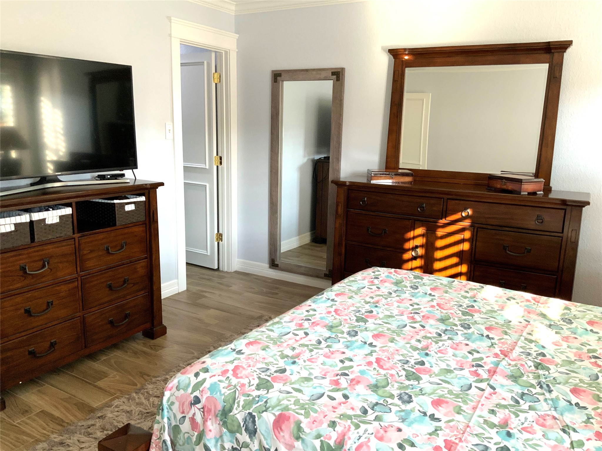 15506 Red Pine Ridge Way Houston, TX 77049 - Photo 22 of 49 a bedroom with a bed and a flat screen tv