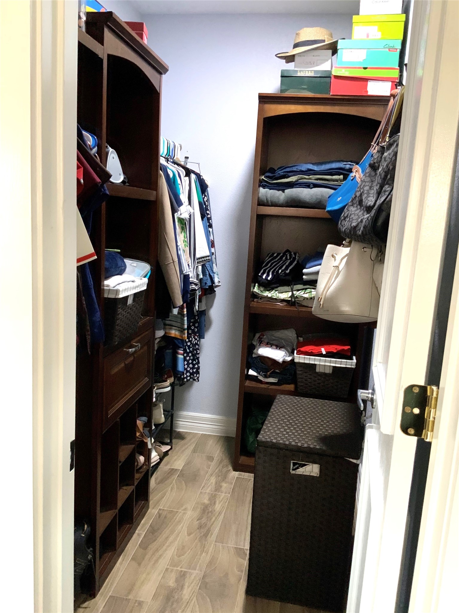 15506 Red Pine Ridge Way Houston, TX 77049 - Photo 23 of 49 a view of walk in closet with clothes and shoes