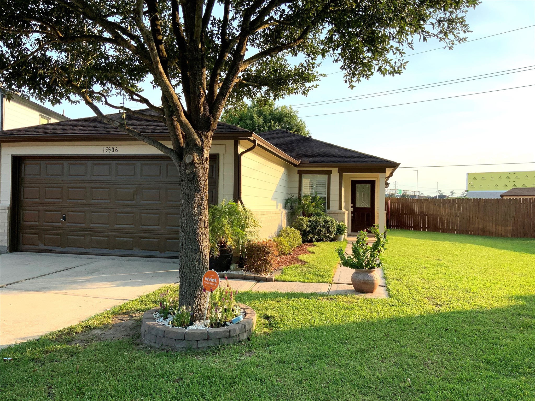 15506 Red Pine Ridge Way Houston, TX 77049 - Photo 3 of 49 a front view of a house with a garden and yard