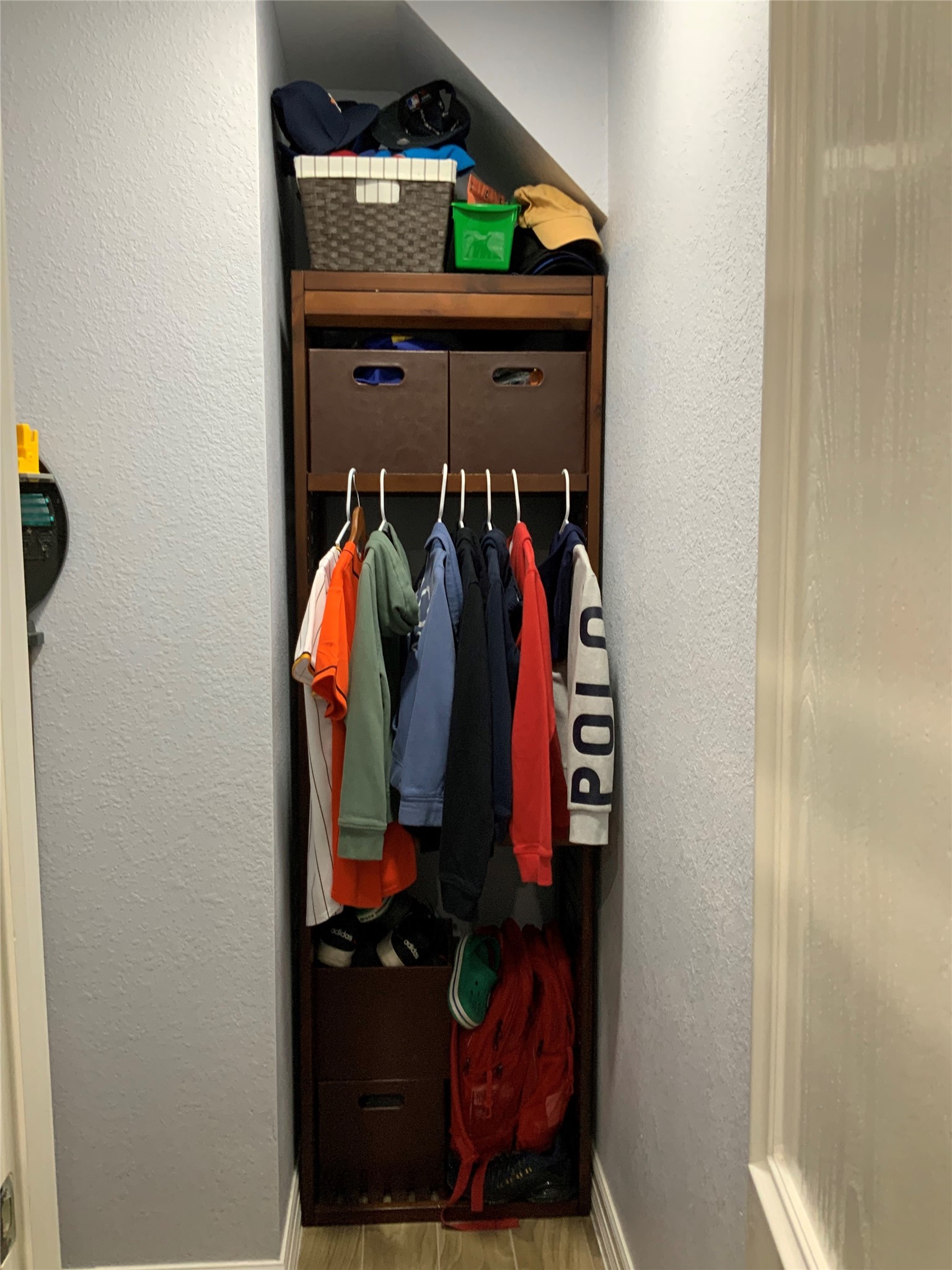 15506 Red Pine Ridge Way Houston, TX 77049 - Photo 32 of 49 a view of walk in closet with clothes and shoes