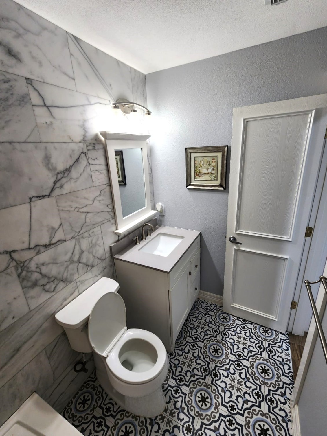 15506 Red Pine Ridge Way Houston, TX 77049 - Photo 34 of 49 a bathroom with a toilet sink and mirror