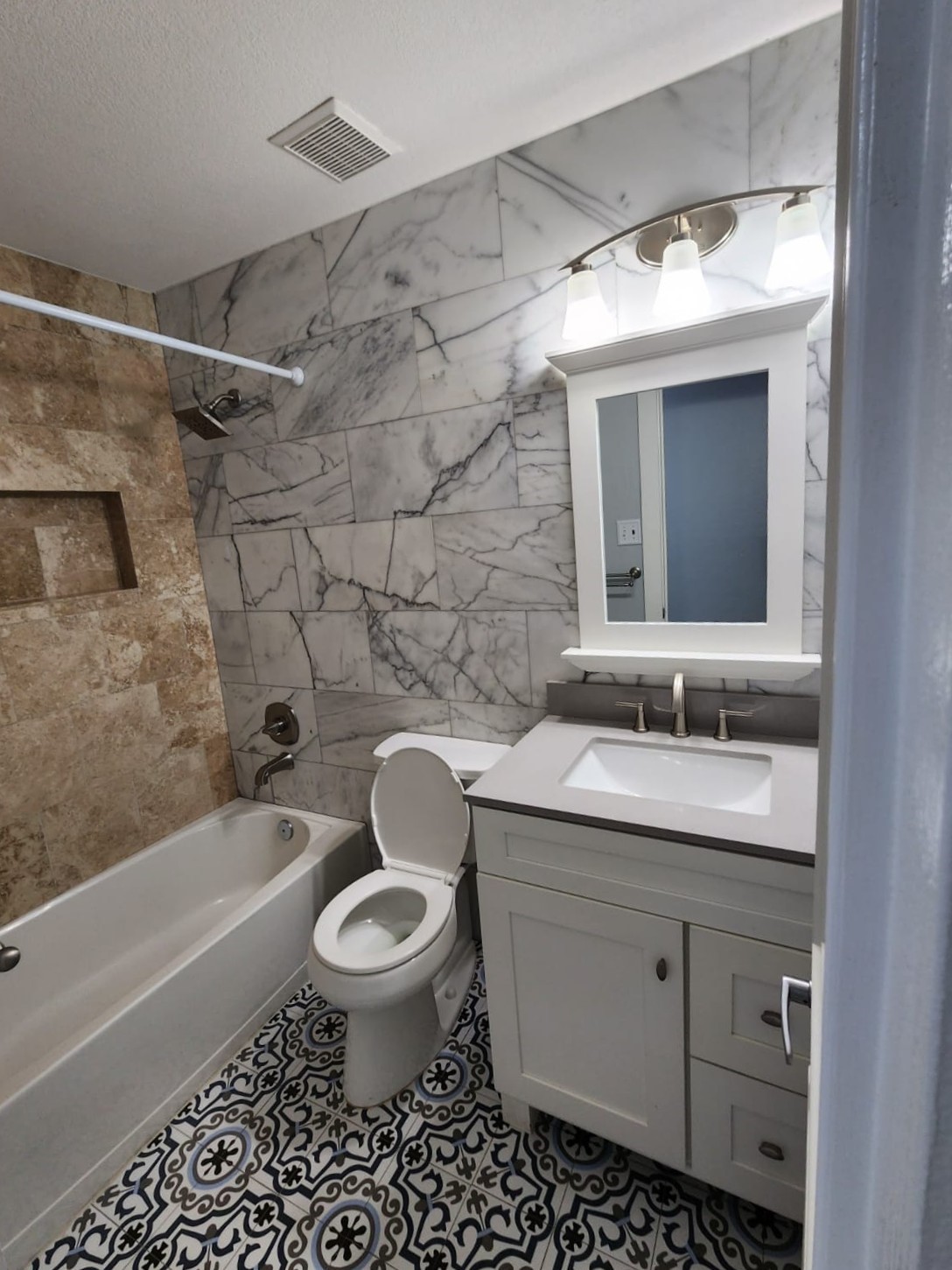 15506 Red Pine Ridge Way Houston, TX 77049 - Photo 35 of 49 a bathroom with a sink toilet a mirror and shower
