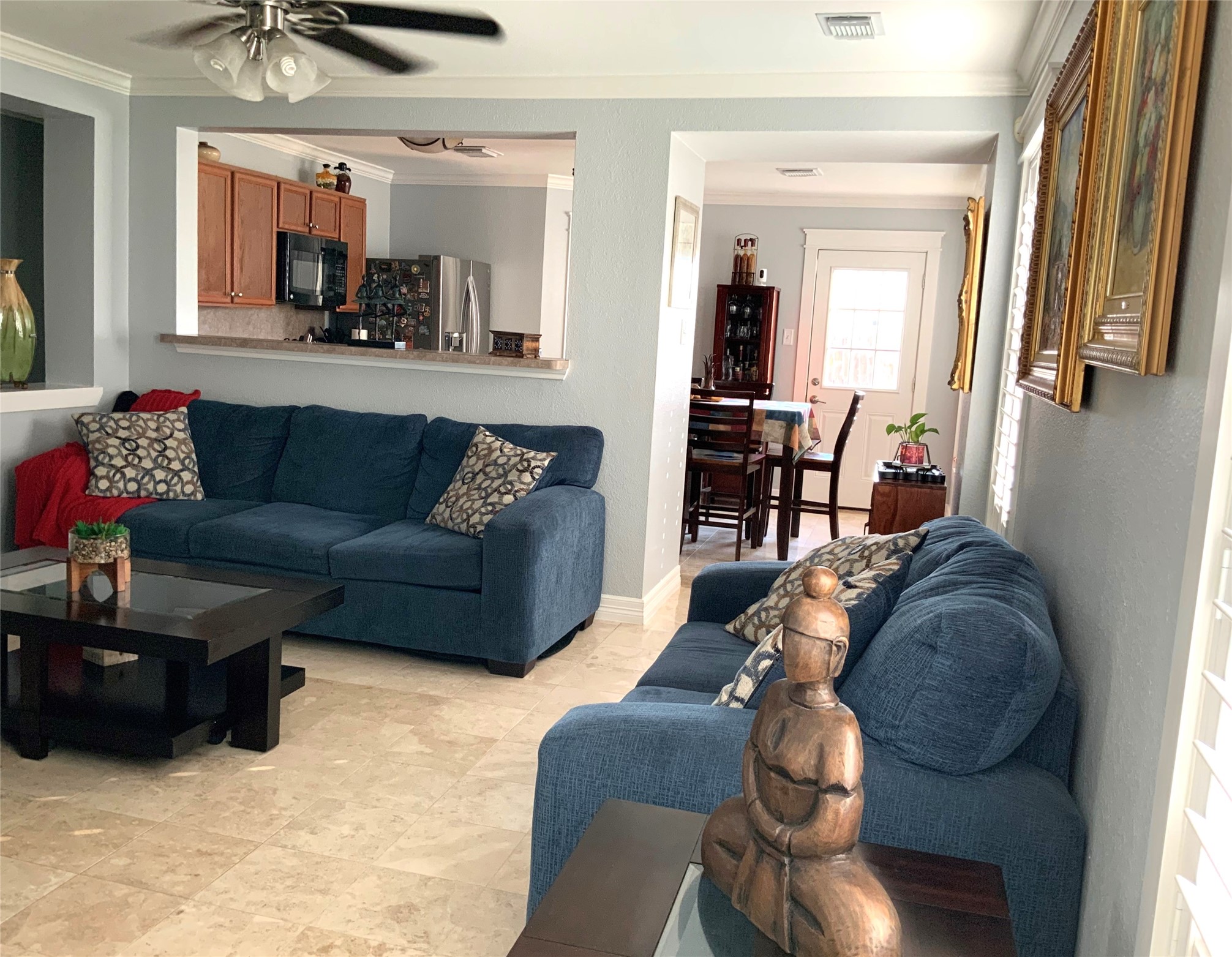 15506 Red Pine Ridge Way Houston, TX 77049 - Photo 6 of 49 a living room with furniture and a chandelier