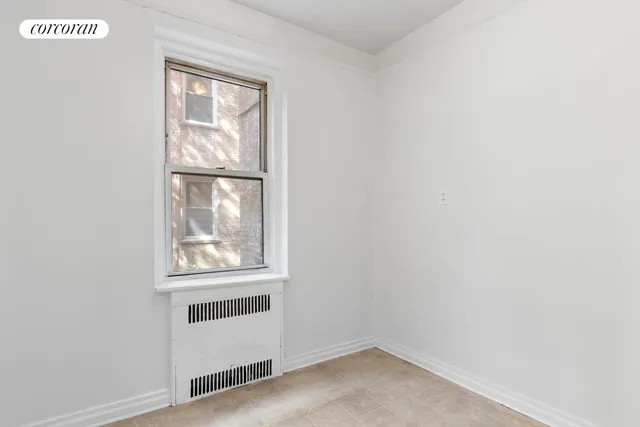 a view of a dining room with furniture and window