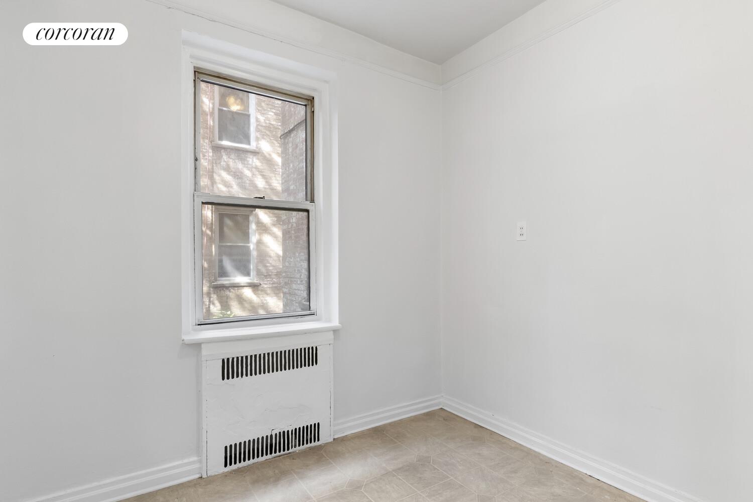 414 Albemarle Road, Unit 1D Brooklyn, NY 11218 - Photo 9 of 13 an empty room with windows