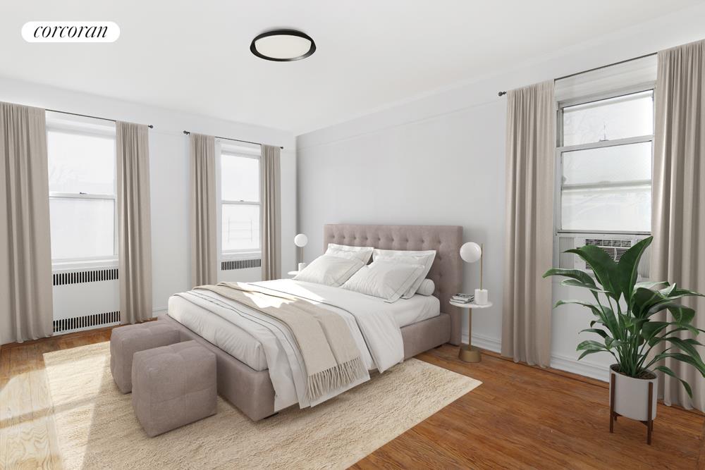 414 Albemarle Road, Unit 1D Brooklyn, NY 11218 - Photo 5 of 13 a bedroom with a large bed and a potted plant