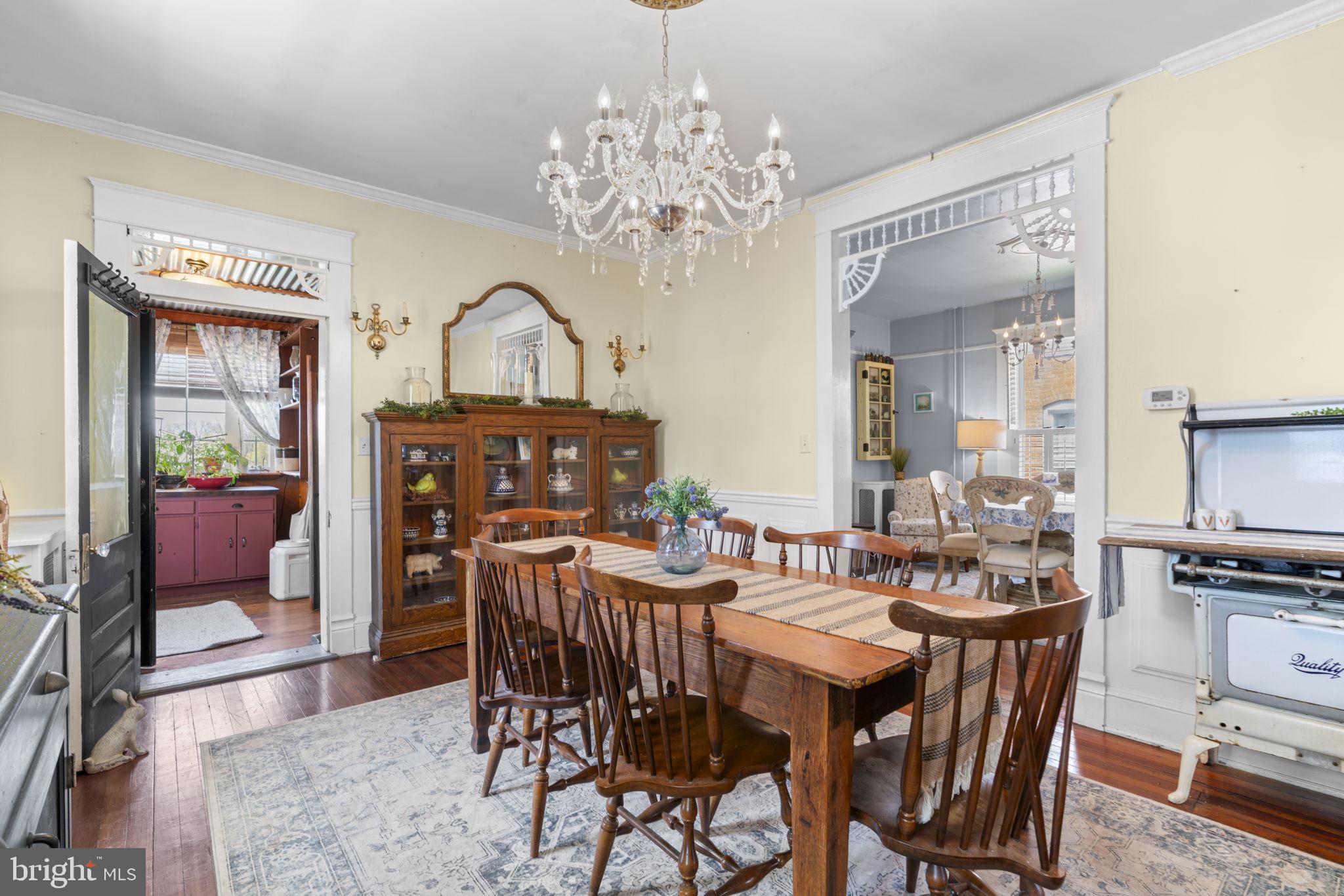 1916 Hanover Pike Hampstead, MD 21074 - Photo 12 of 46 a view of a dining room with furniture and chandelier